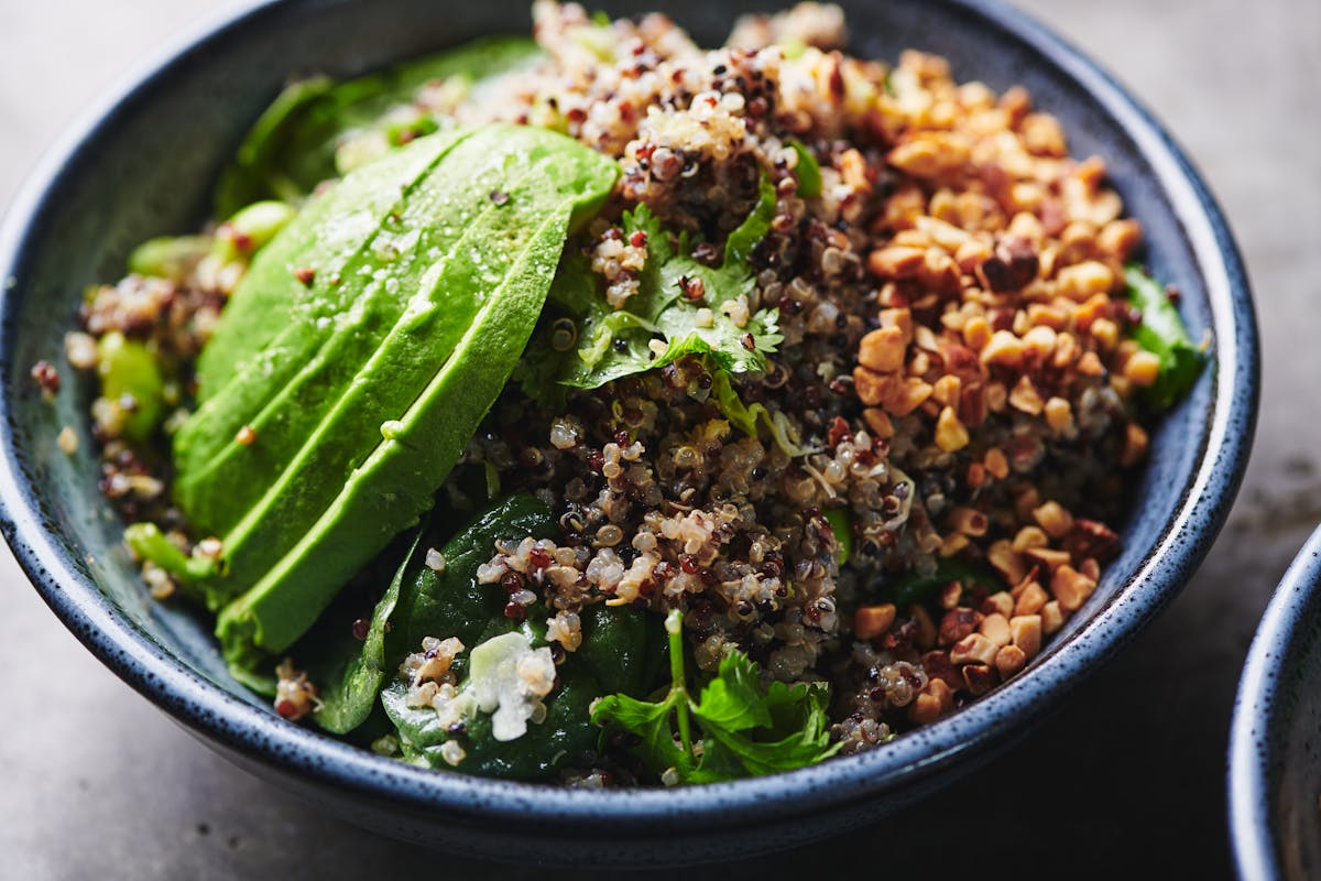 a bowl of food with broccoli