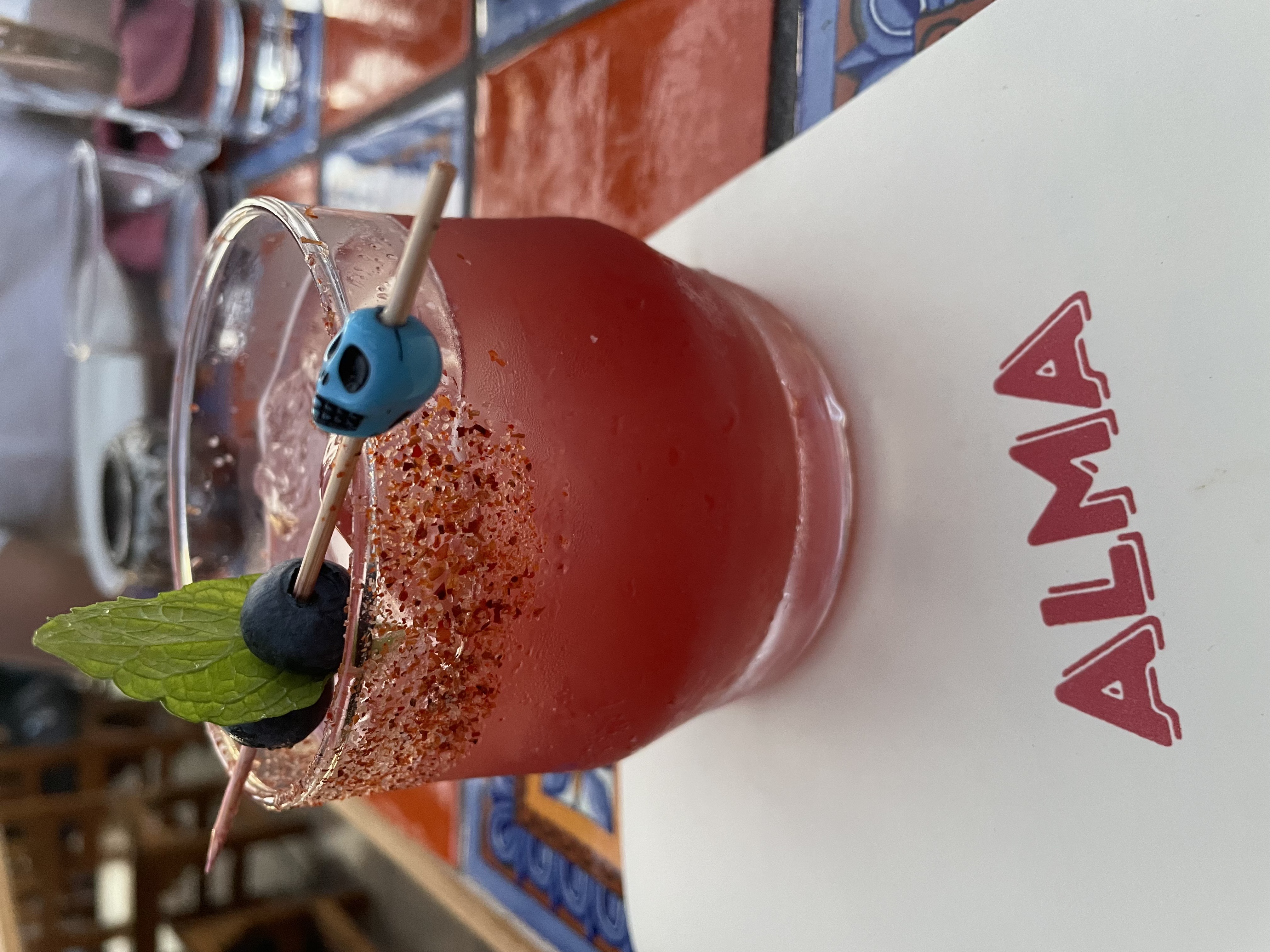 a drink with a blue skull on it