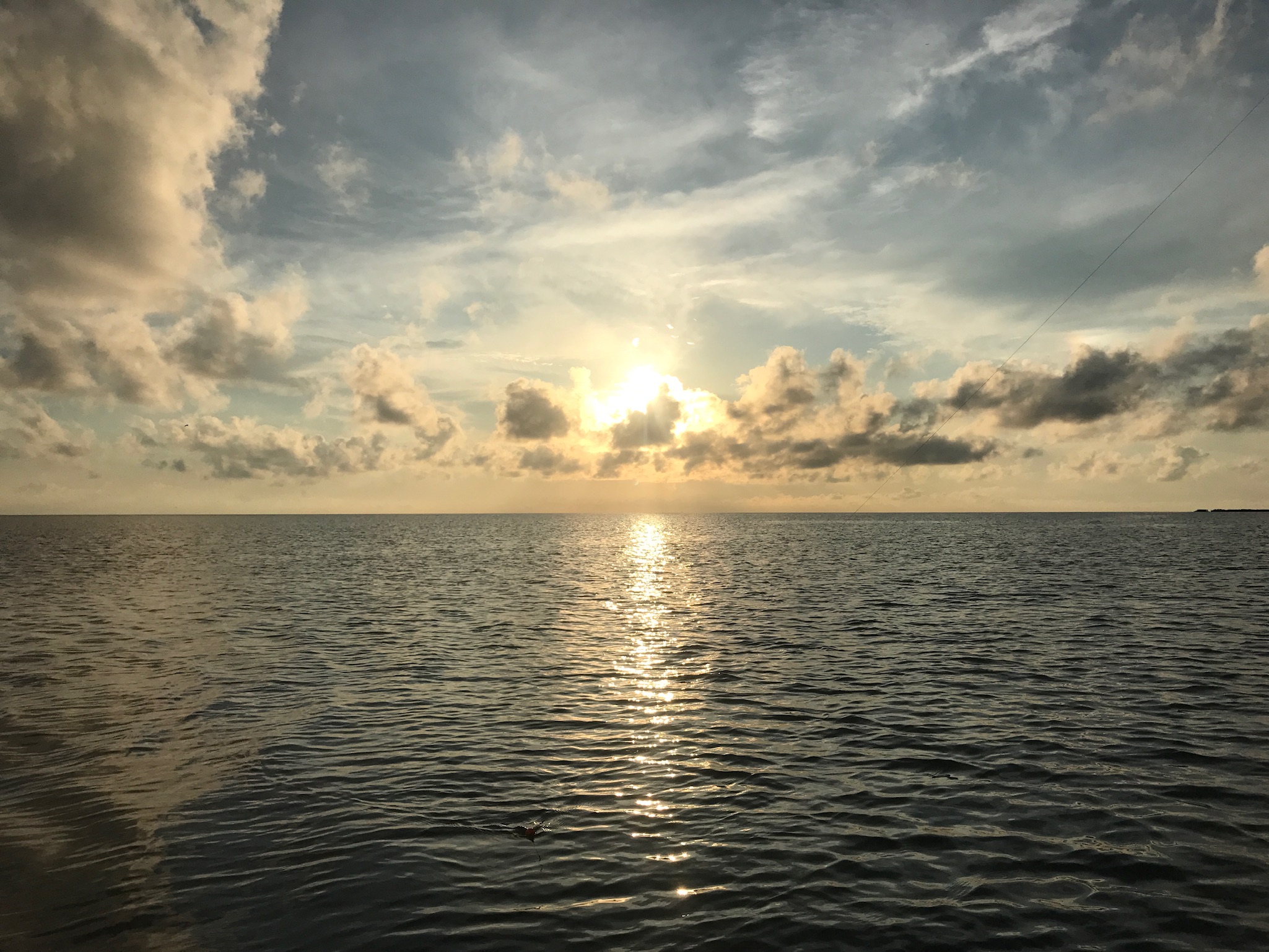 a sunset over a body of water