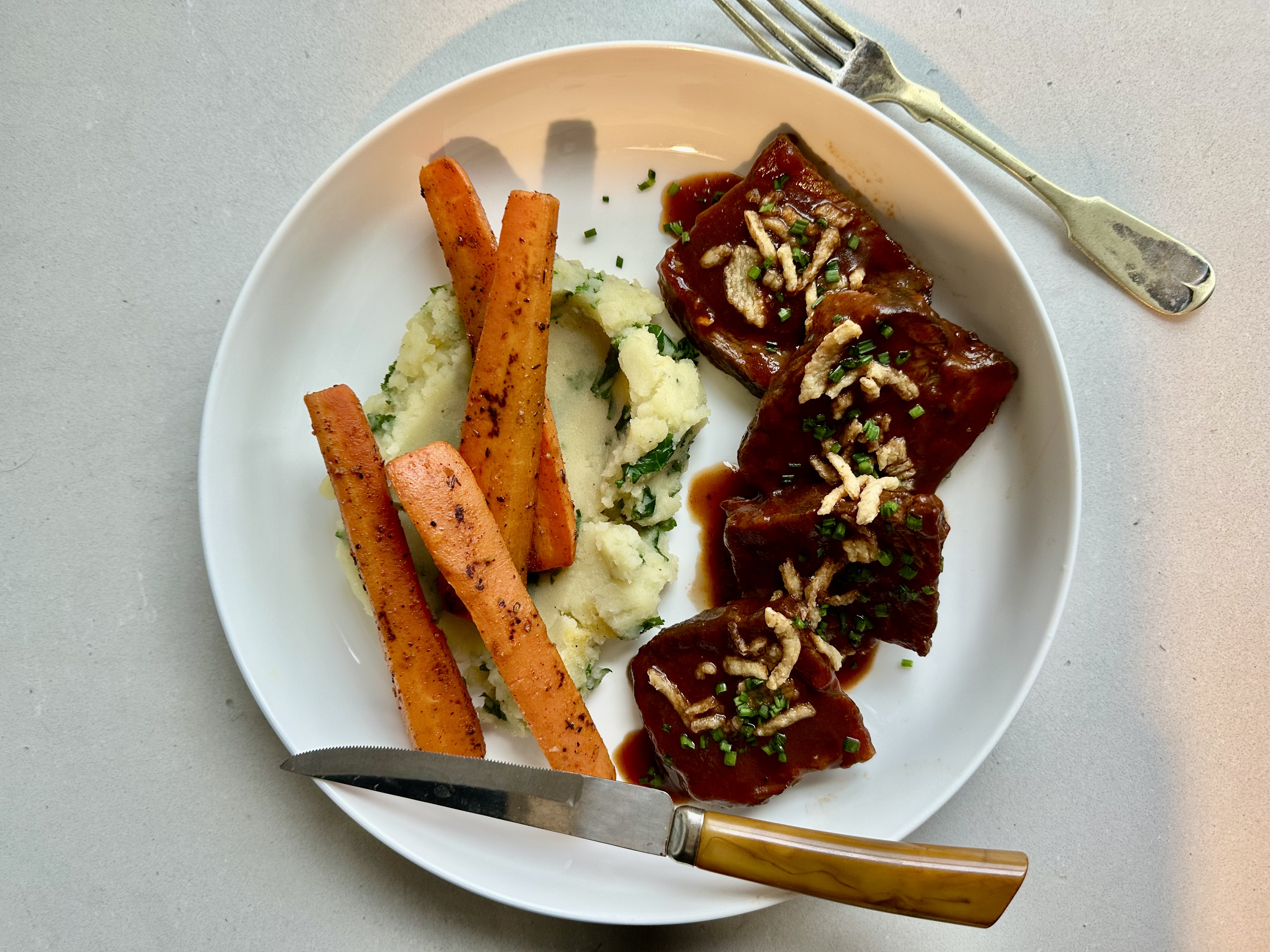 a plate of food with a fork and knife