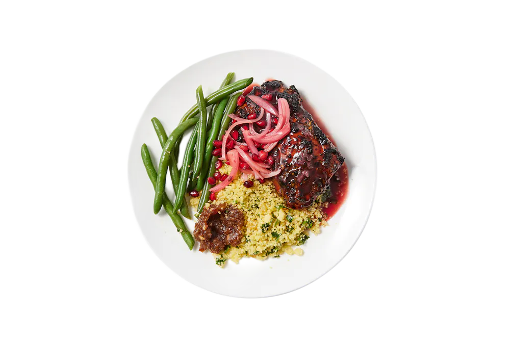 a plate of food on a black background