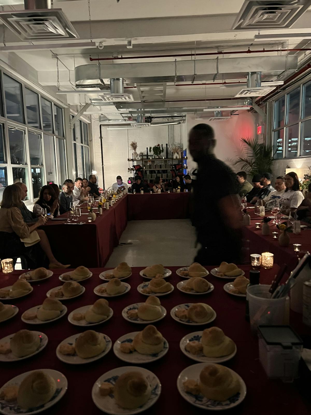 a group of people sitting at a table in a restaurant