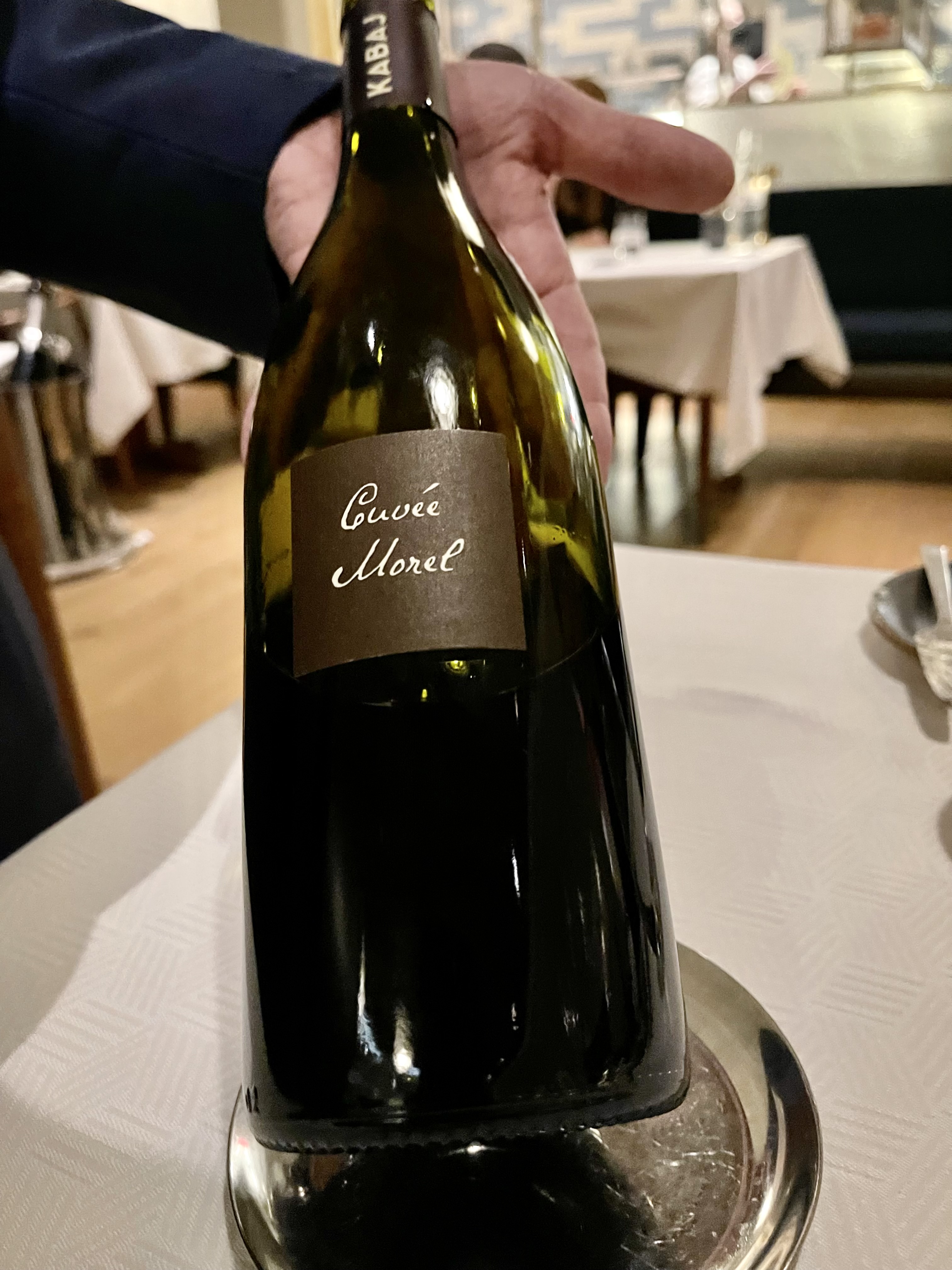 a bottle of wine and a glass of beer on a table