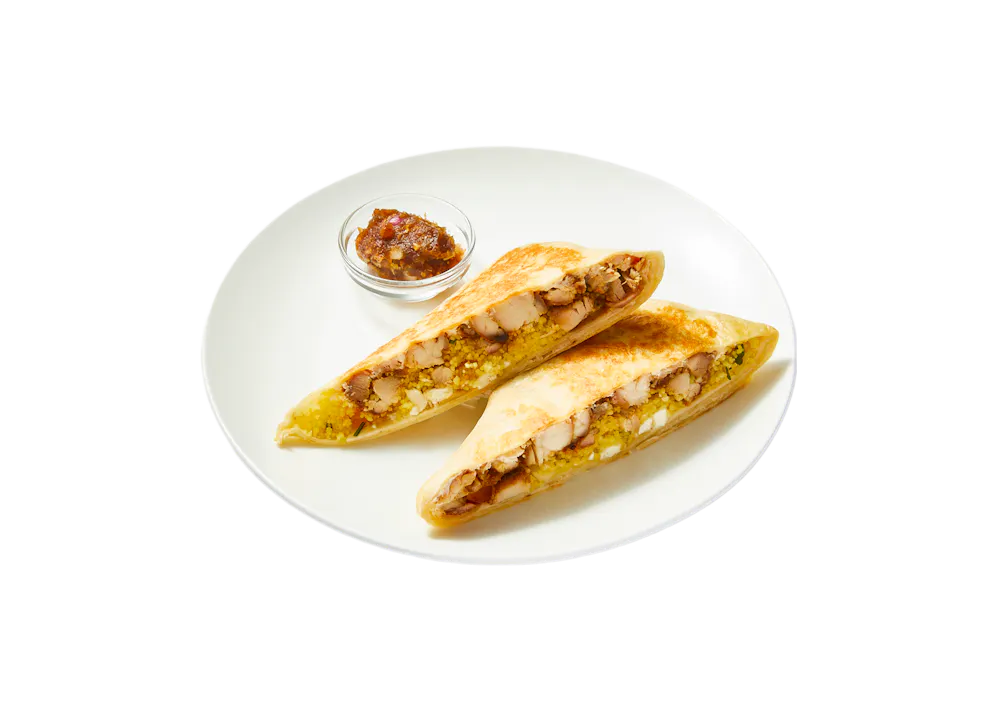 a plate of food on a black background