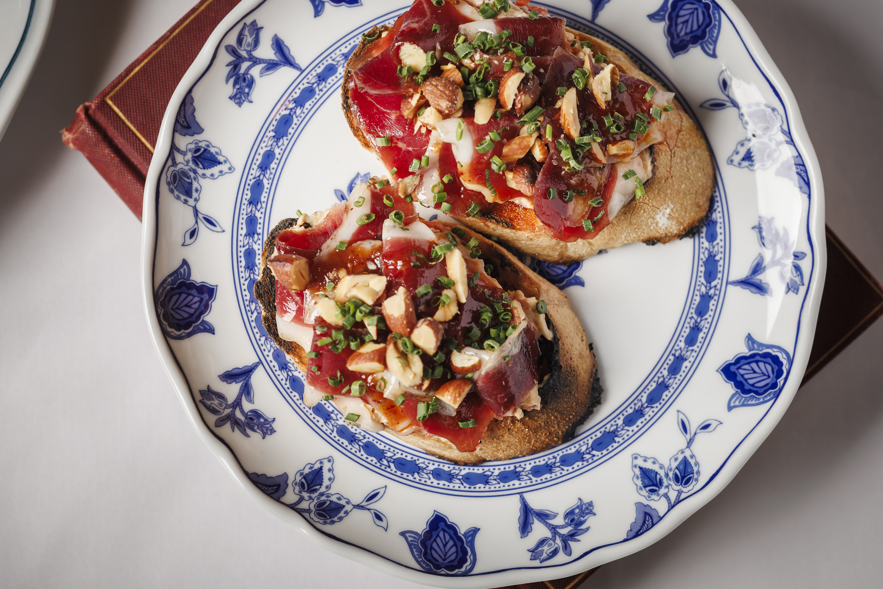 Duck Prosciutto  manchego pimento cheese, quince syrup, smoked almonds, duck chicharron