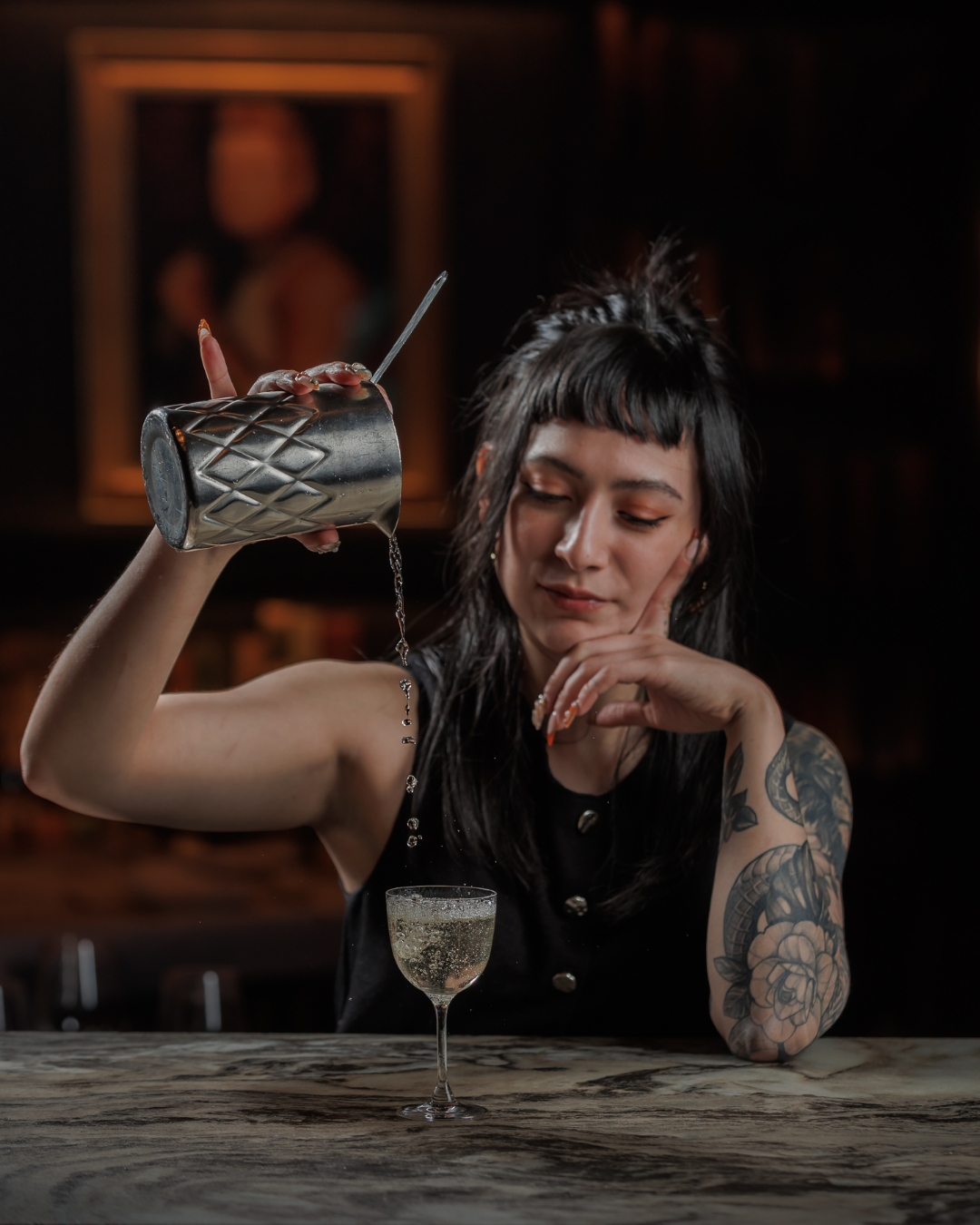 Bar Lead Pouring a Martini