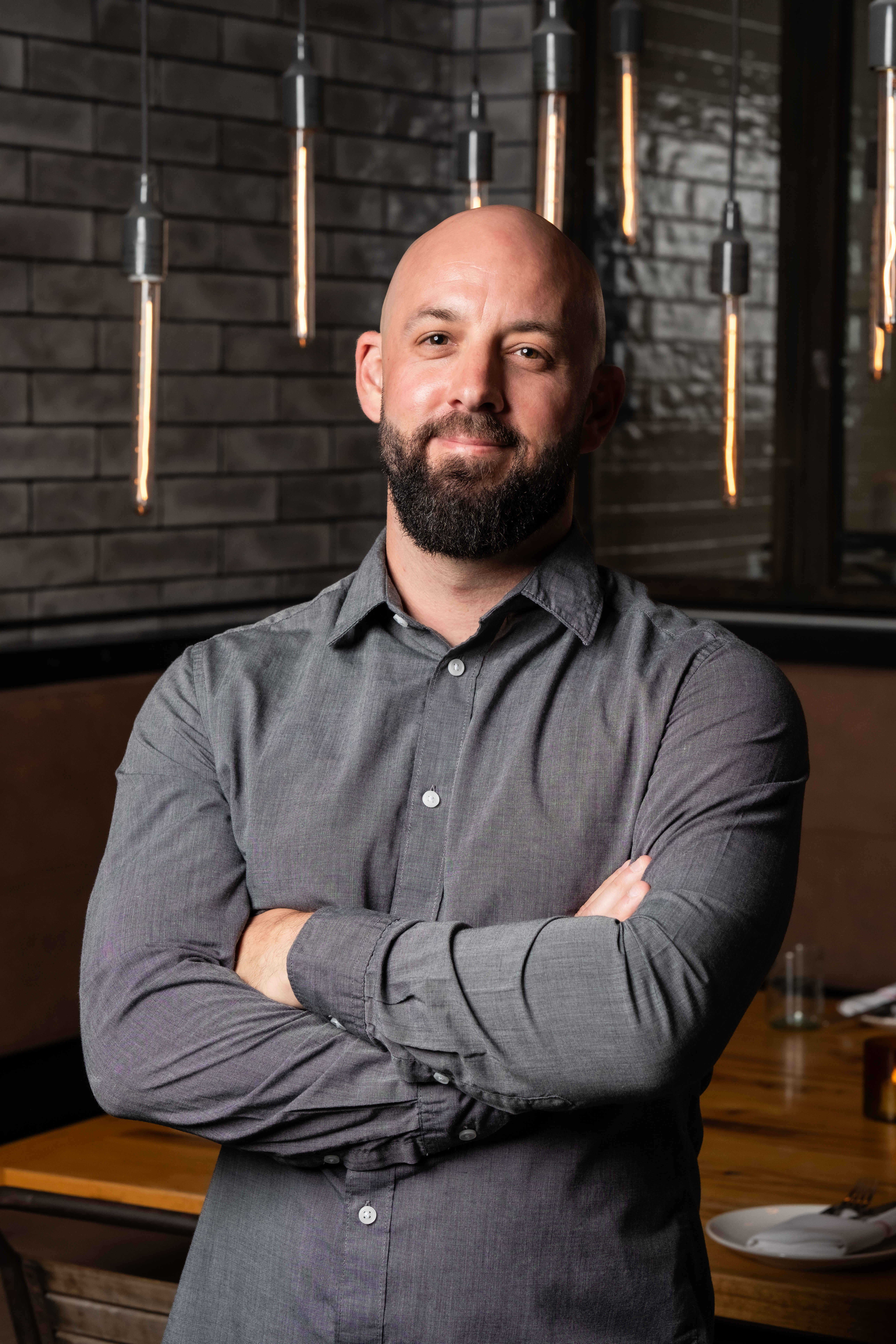 a man standing in front of a table