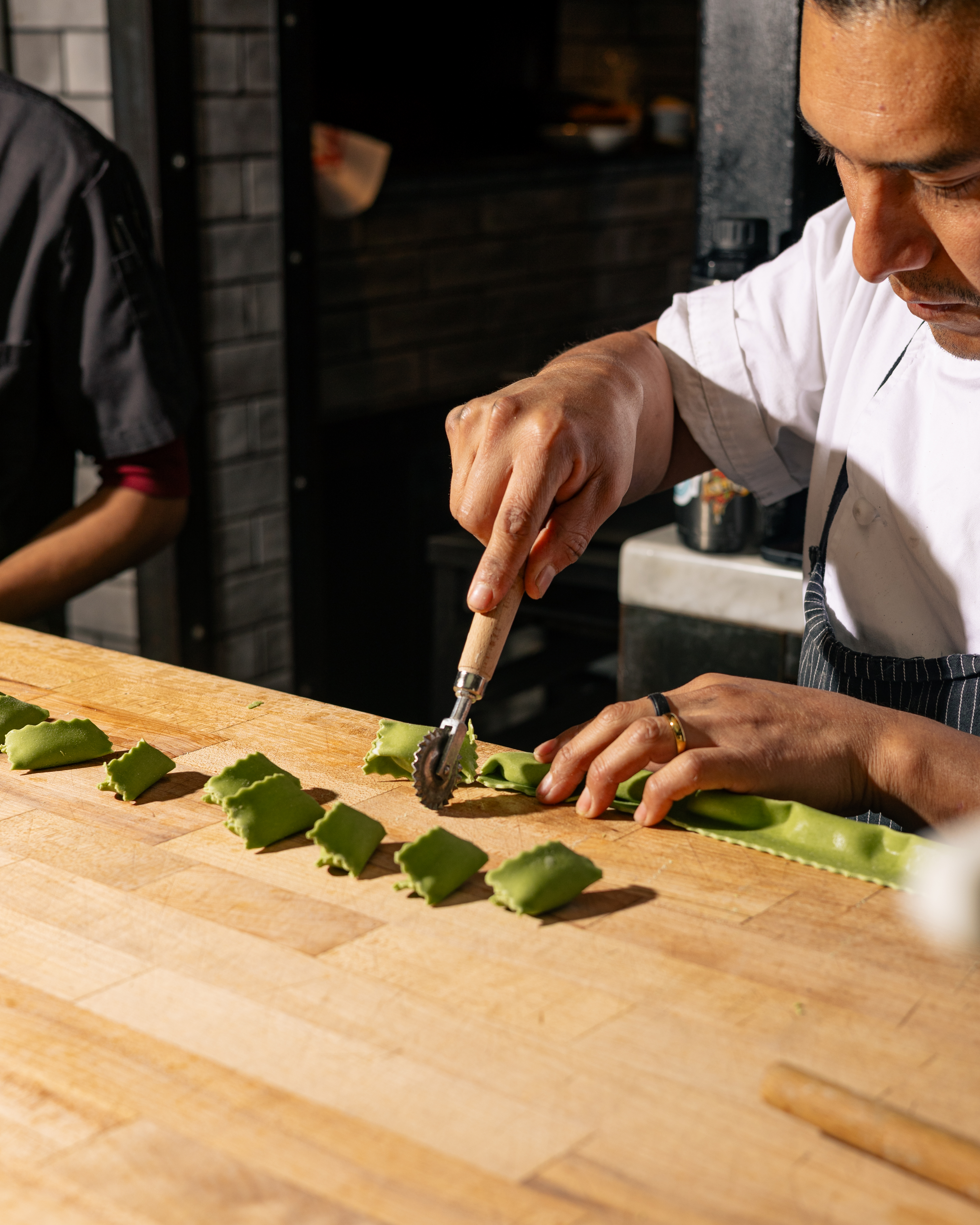 a chef slicing cucumbers