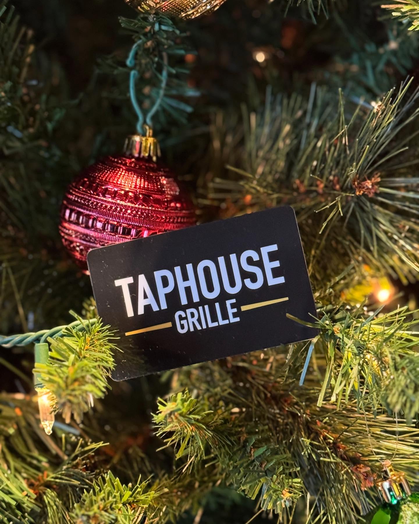 a sign hanging from a tree