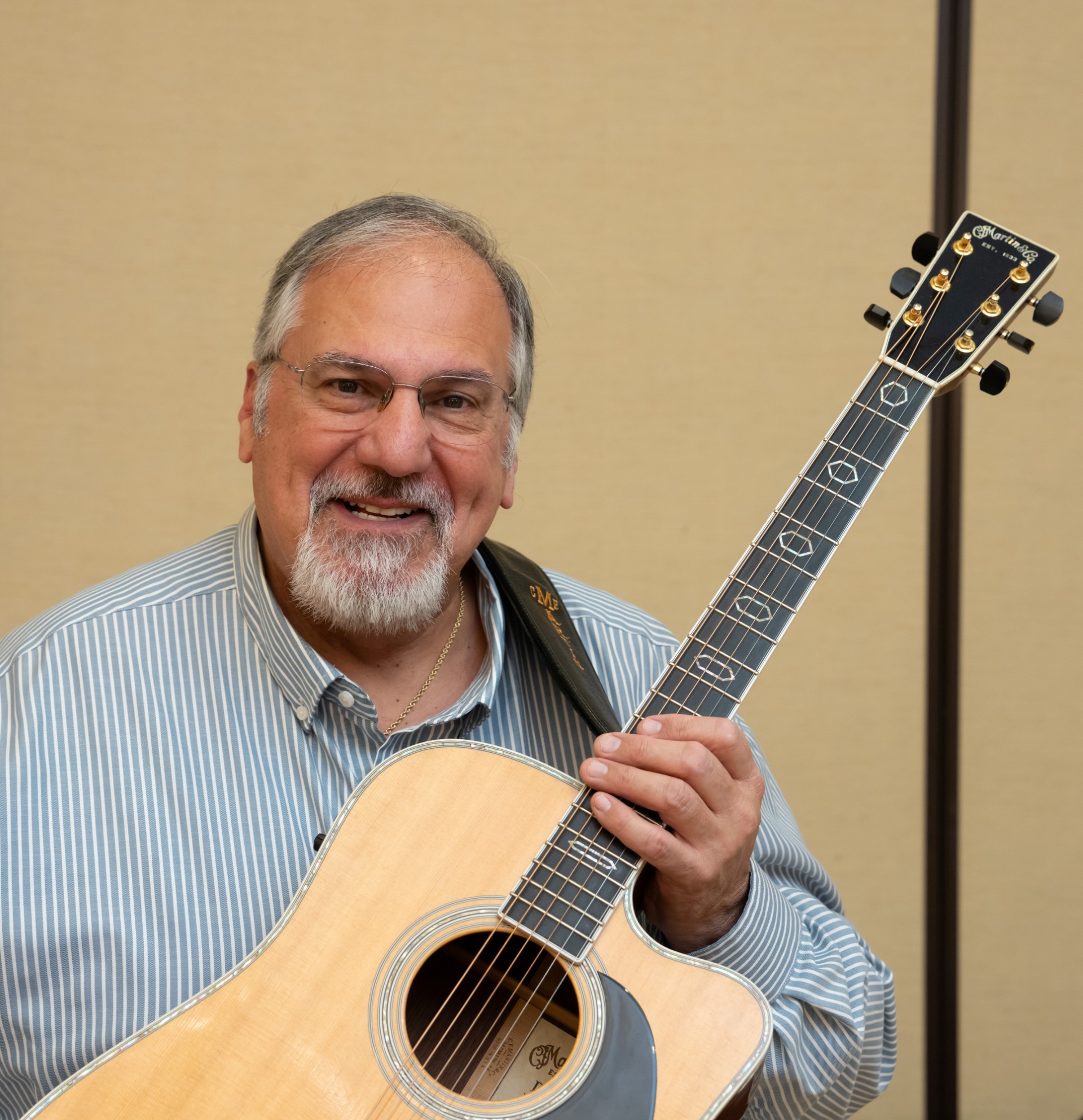 a man holding a guitar