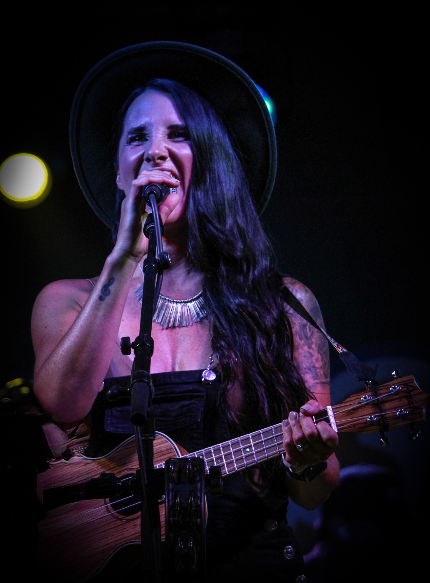 a woman singing into a microphone