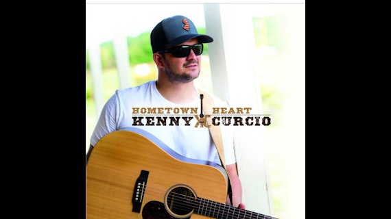 picture of a man holding a guitar