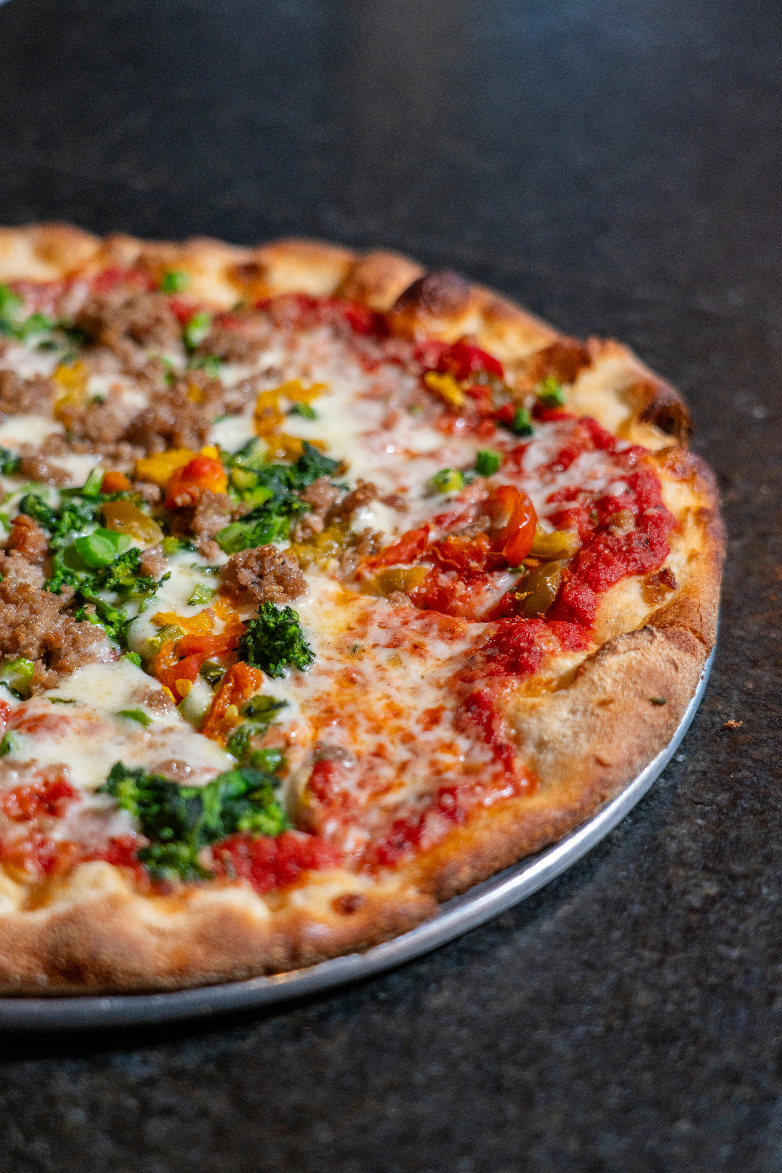 a pizza sitting on top of a pan