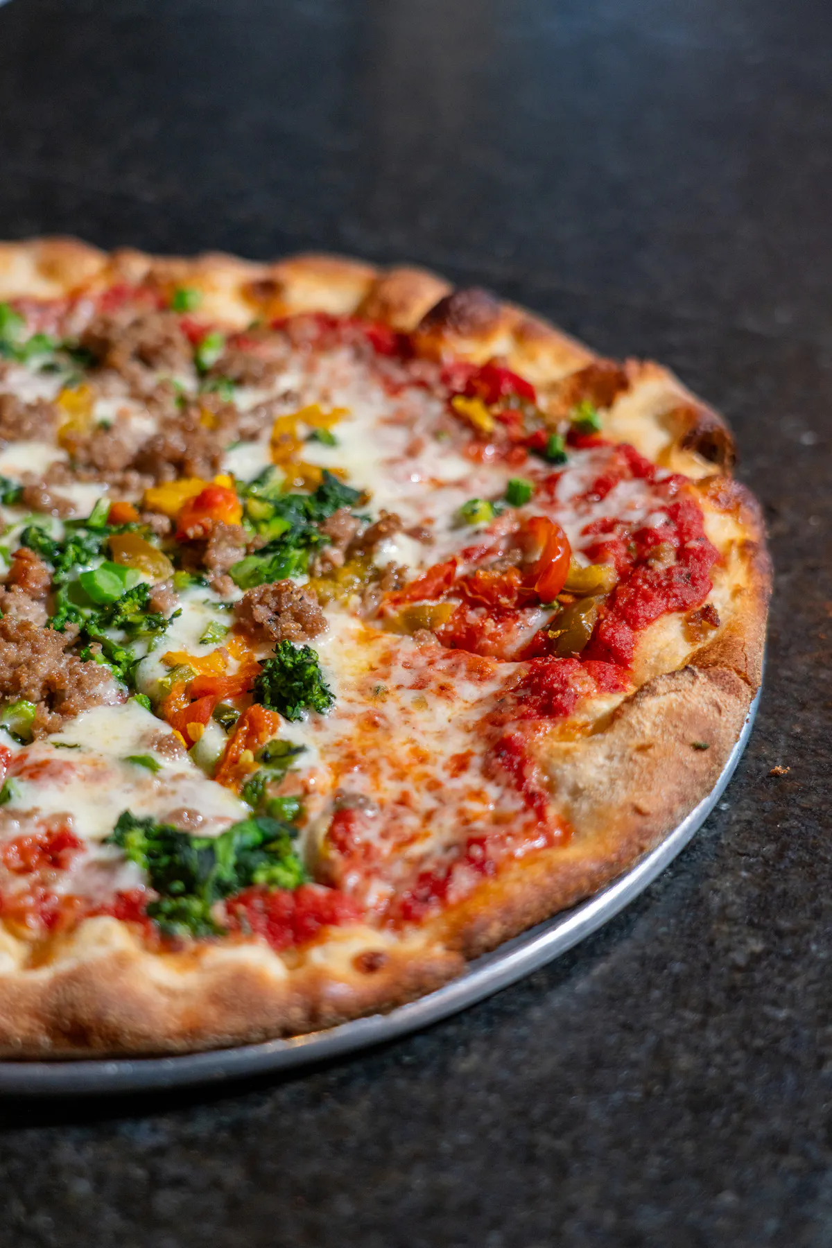 a pizza sitting on top of a pan
