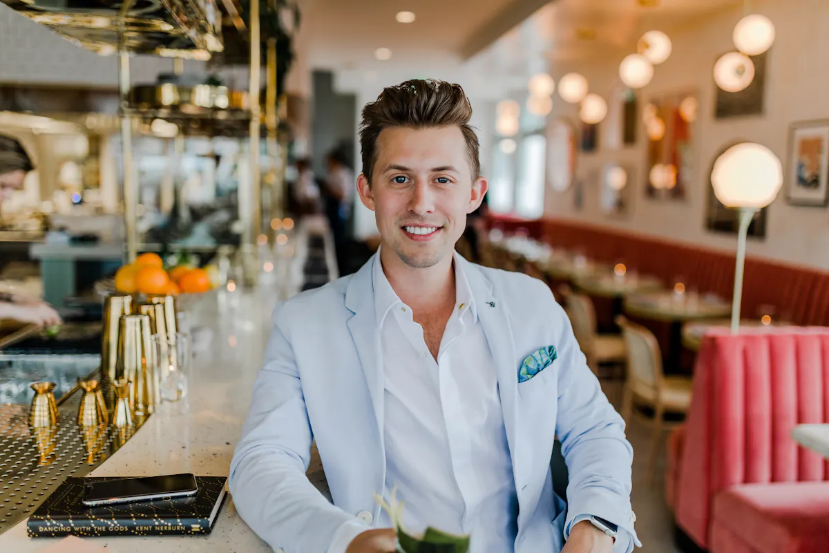 a person sitting at a table in a restaurant