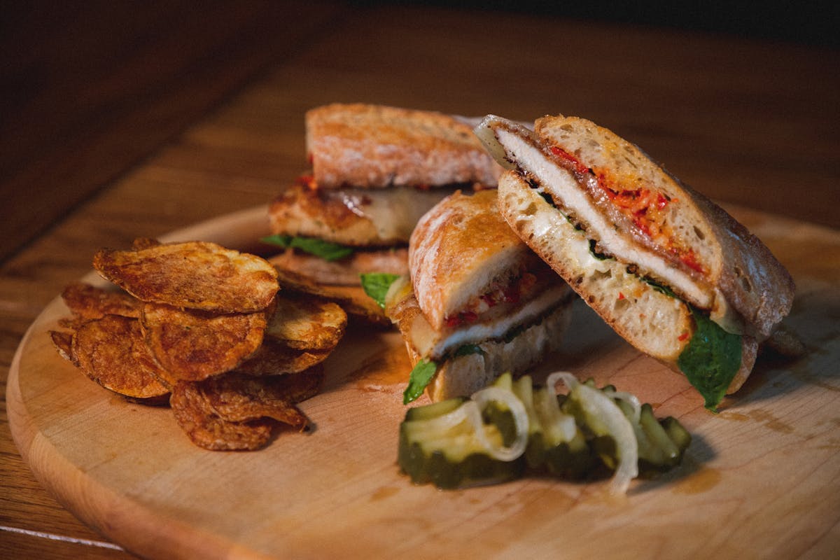 a sandwich sitting on top of a wooden table