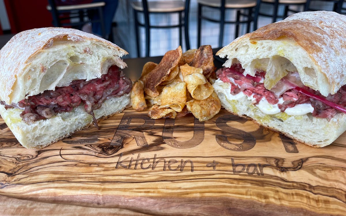 a cut in half sandwich sitting on top of a table