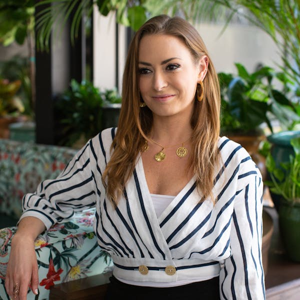 a person in striped shirt sitting on a table