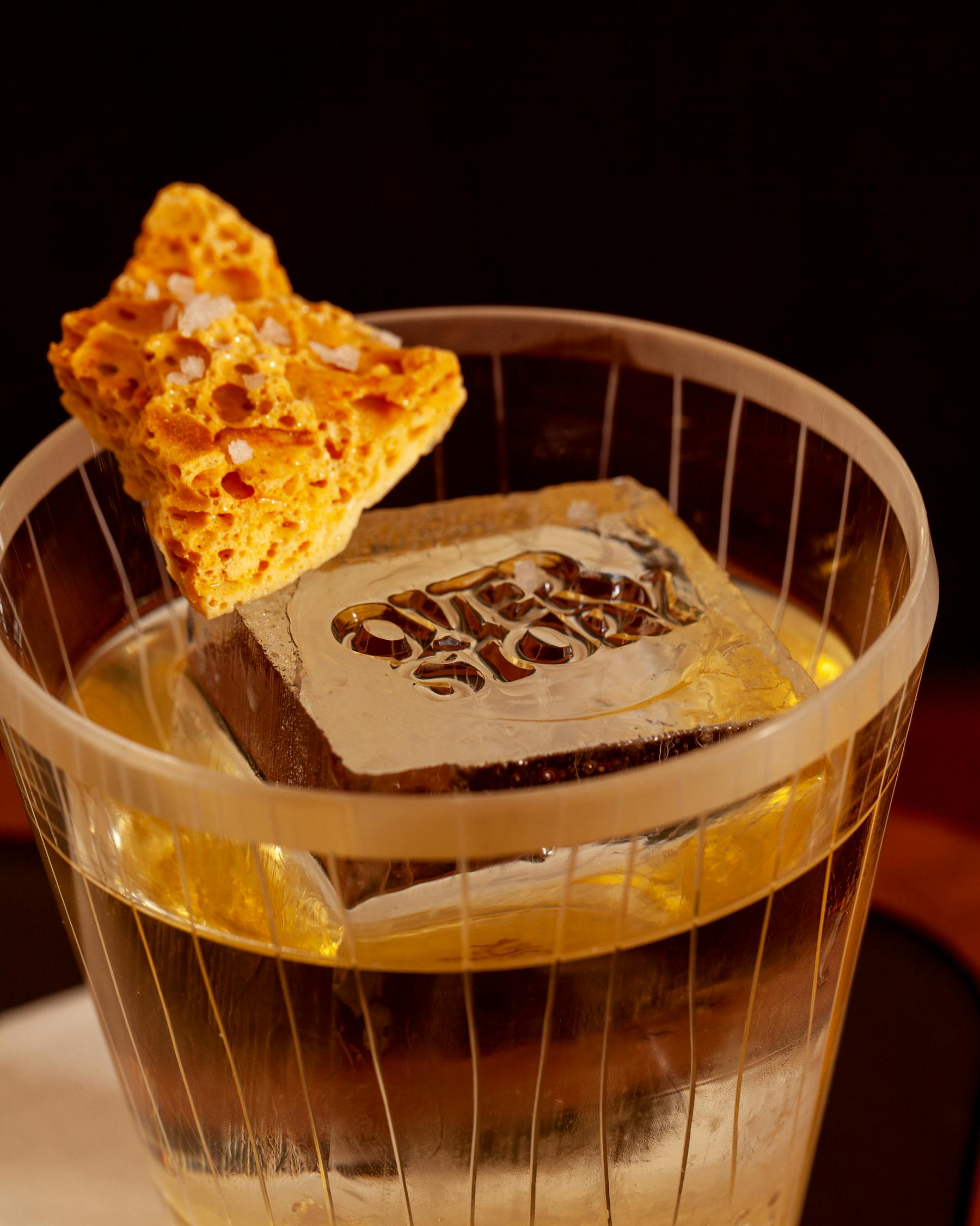 cocktail topped with honeycomb