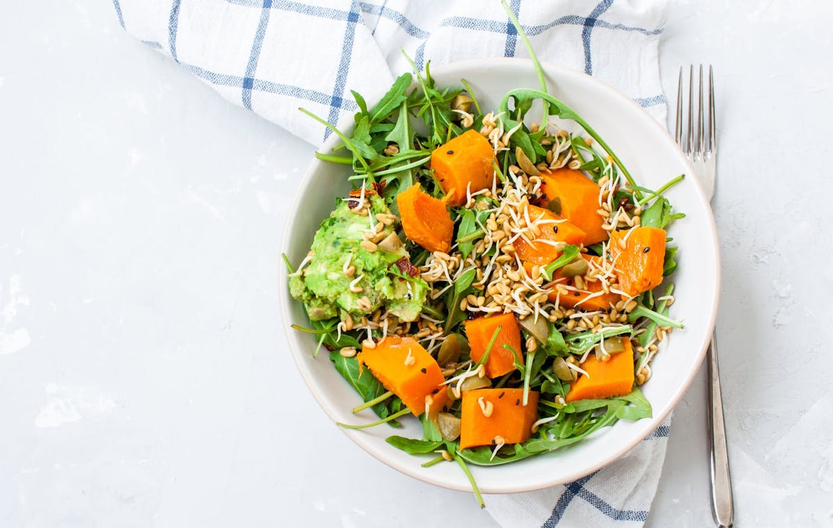 a bowl of salad on a plate