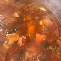 a close up of a bowl of food with stew