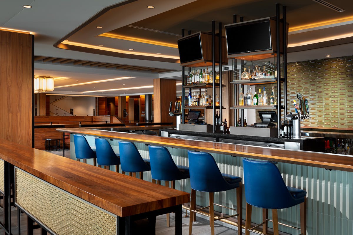 a dining room table in front of a window