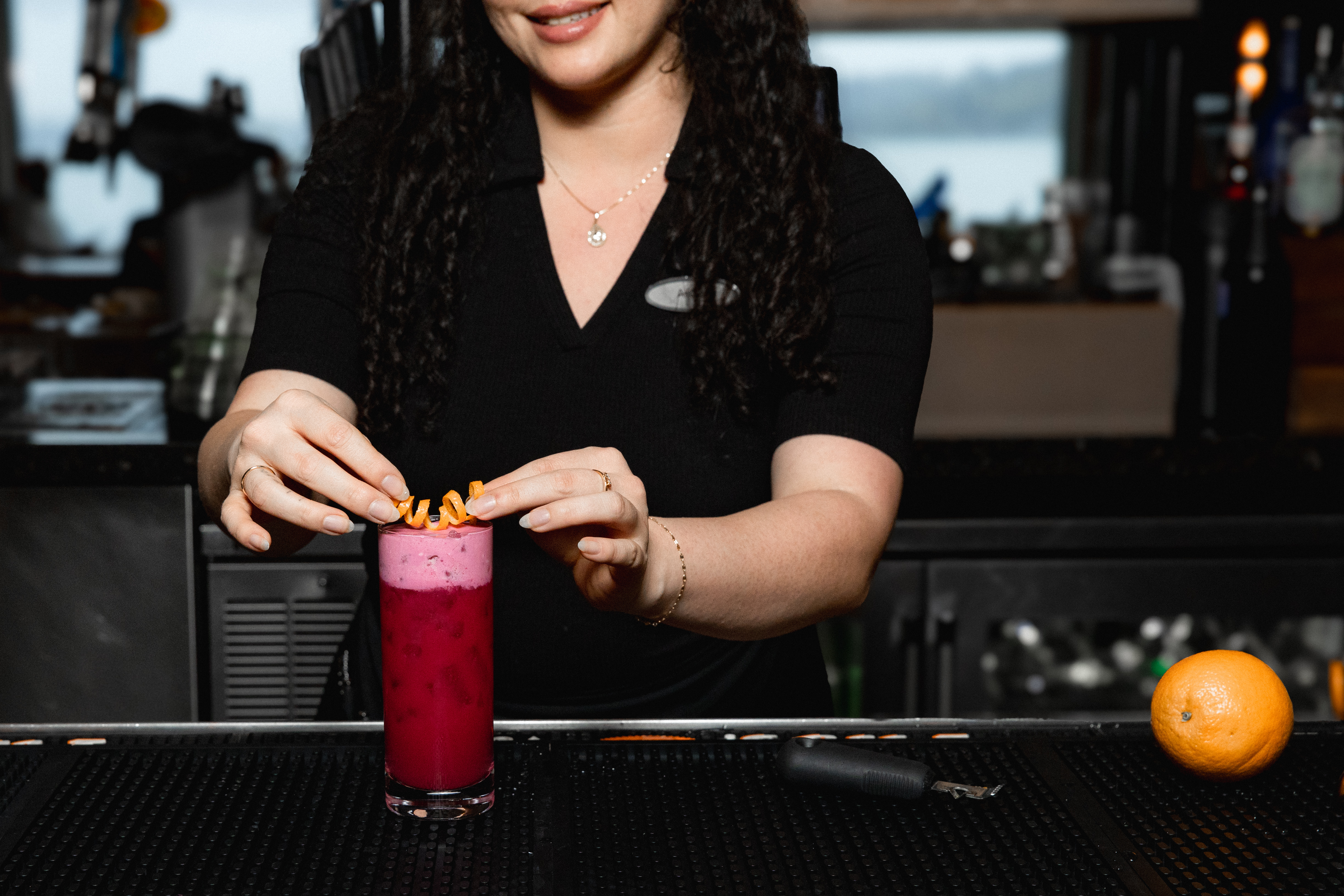 a woman making a drink