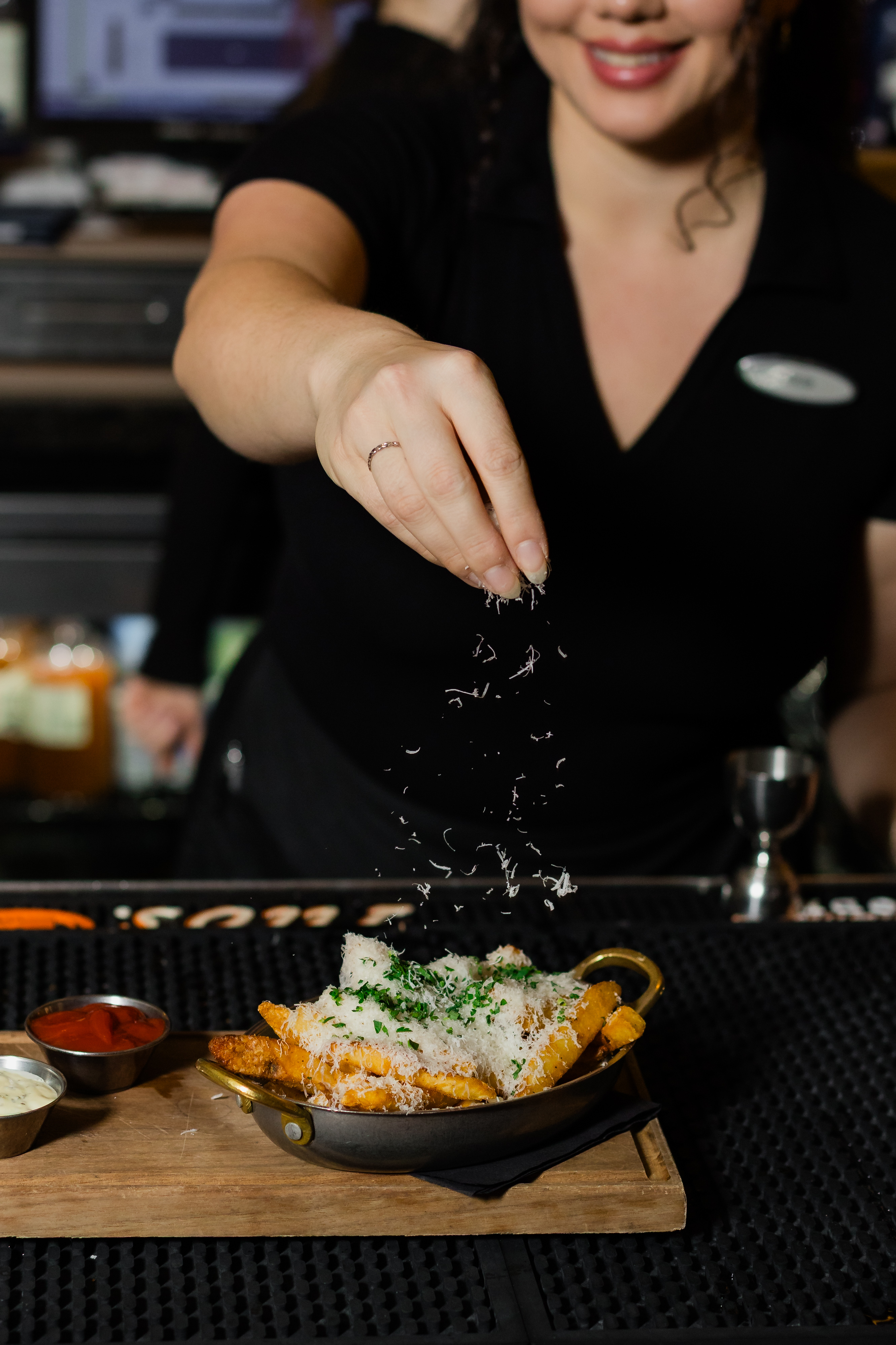 a woman sitting at a table with a plate of food