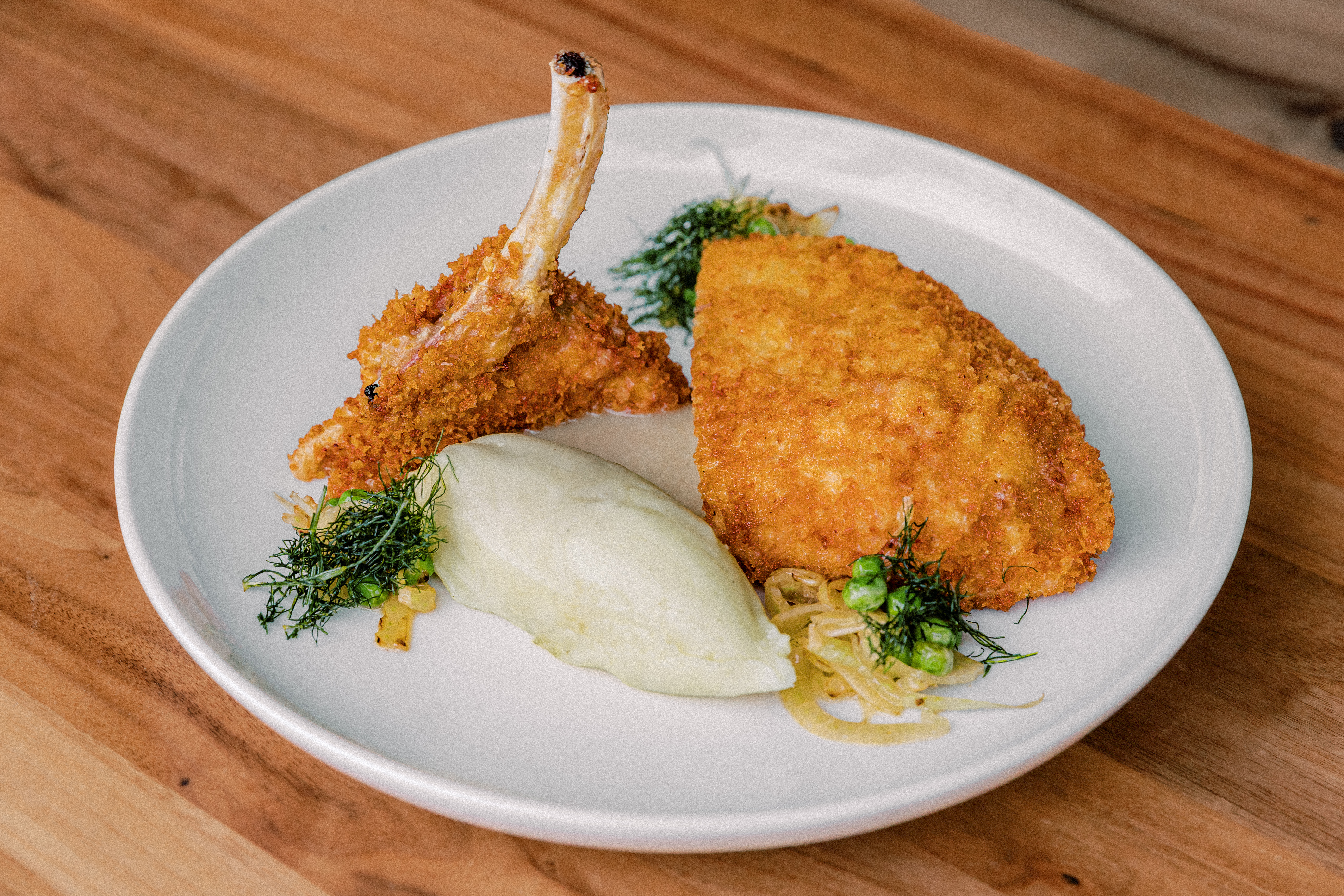 a plate of food on a wood table