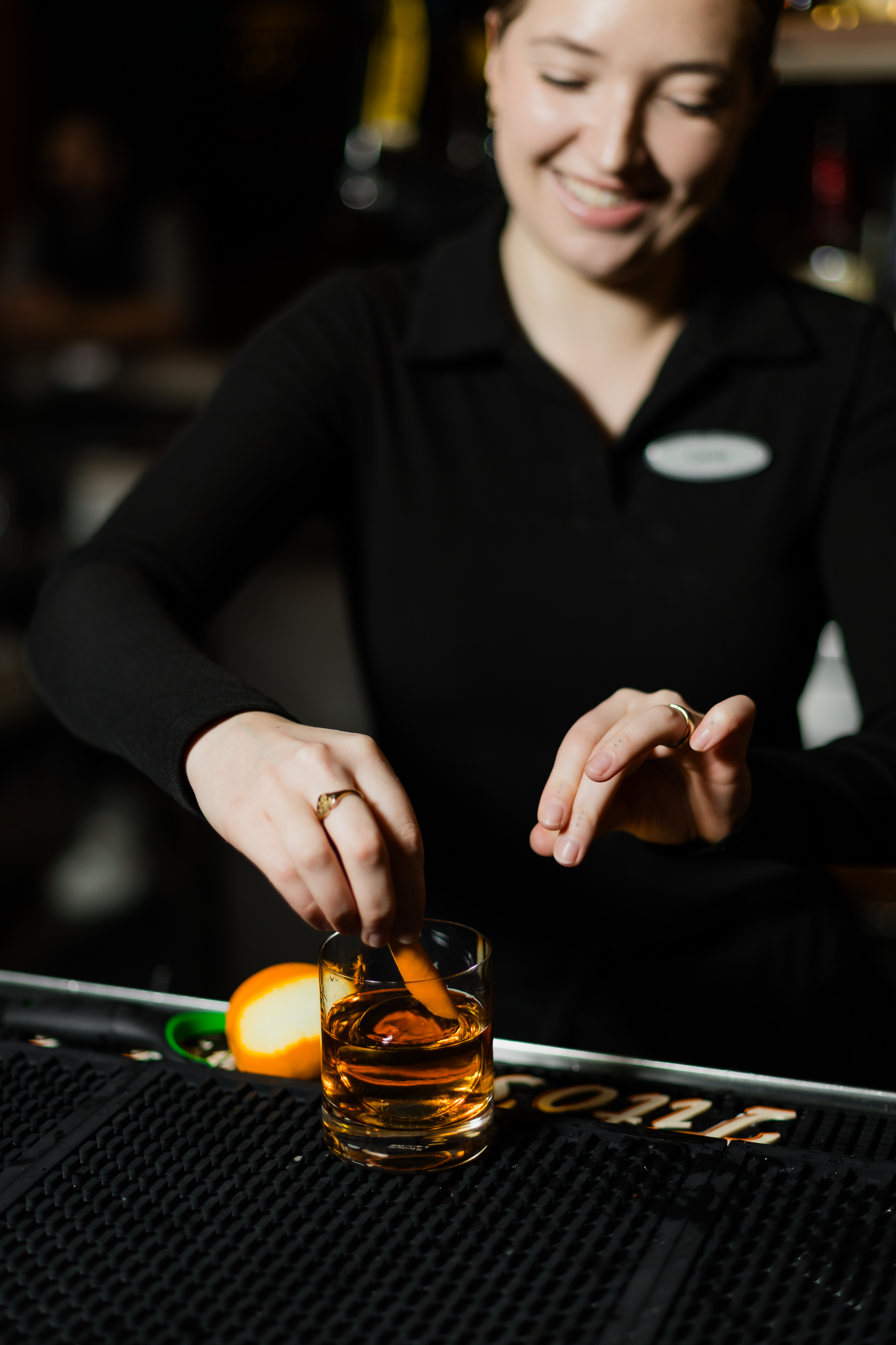 Bartender making craft cocktail