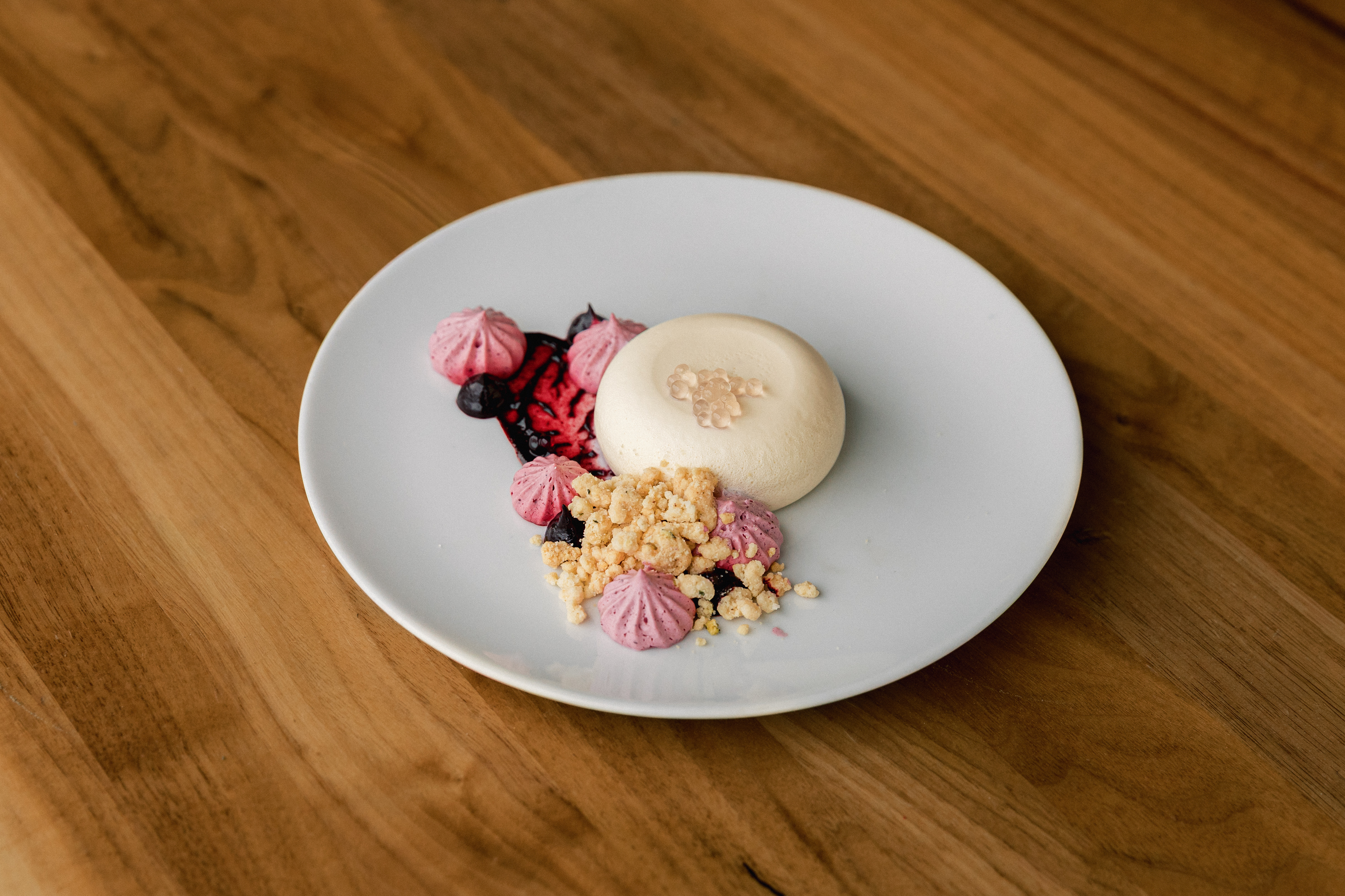a plate of dessert on a wood table