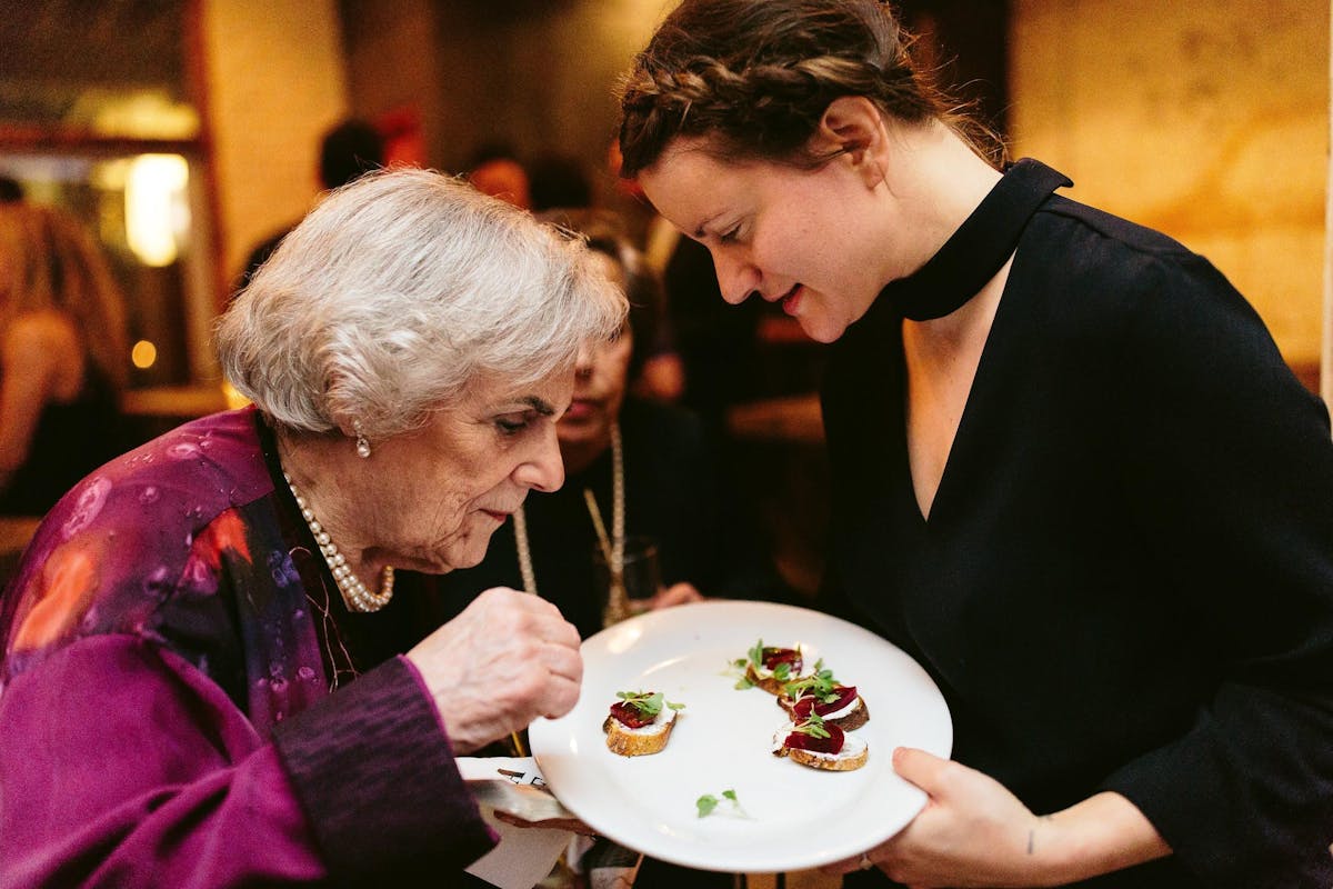 a man and a woman eating a plate of food