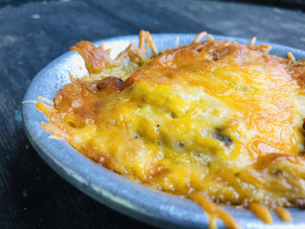 a close up of a bowl filled with cheese