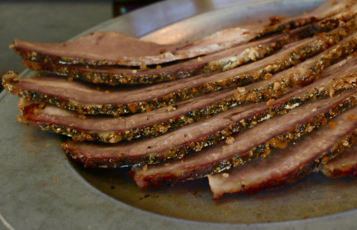 a close up of a plate of hot dogs