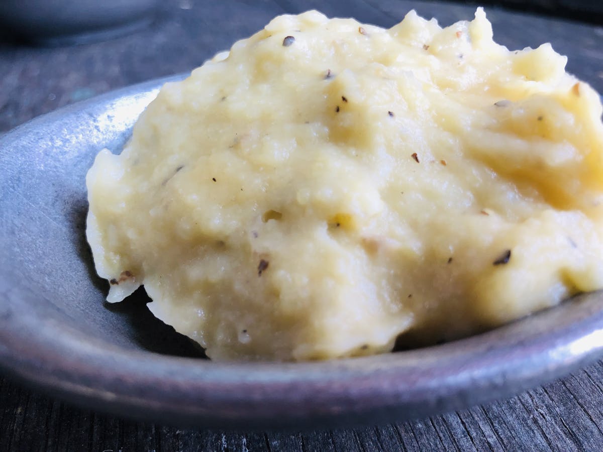 a close up of smashed potatoes