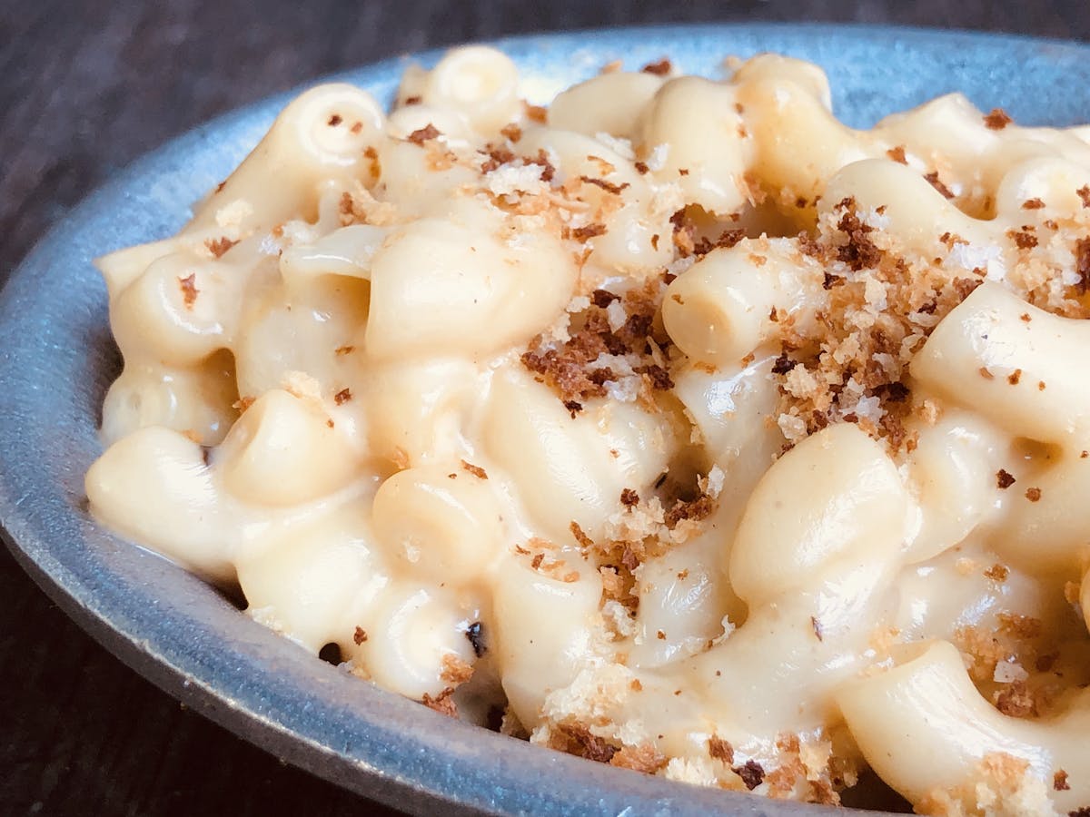 a close up of a bowl filled with macaroni