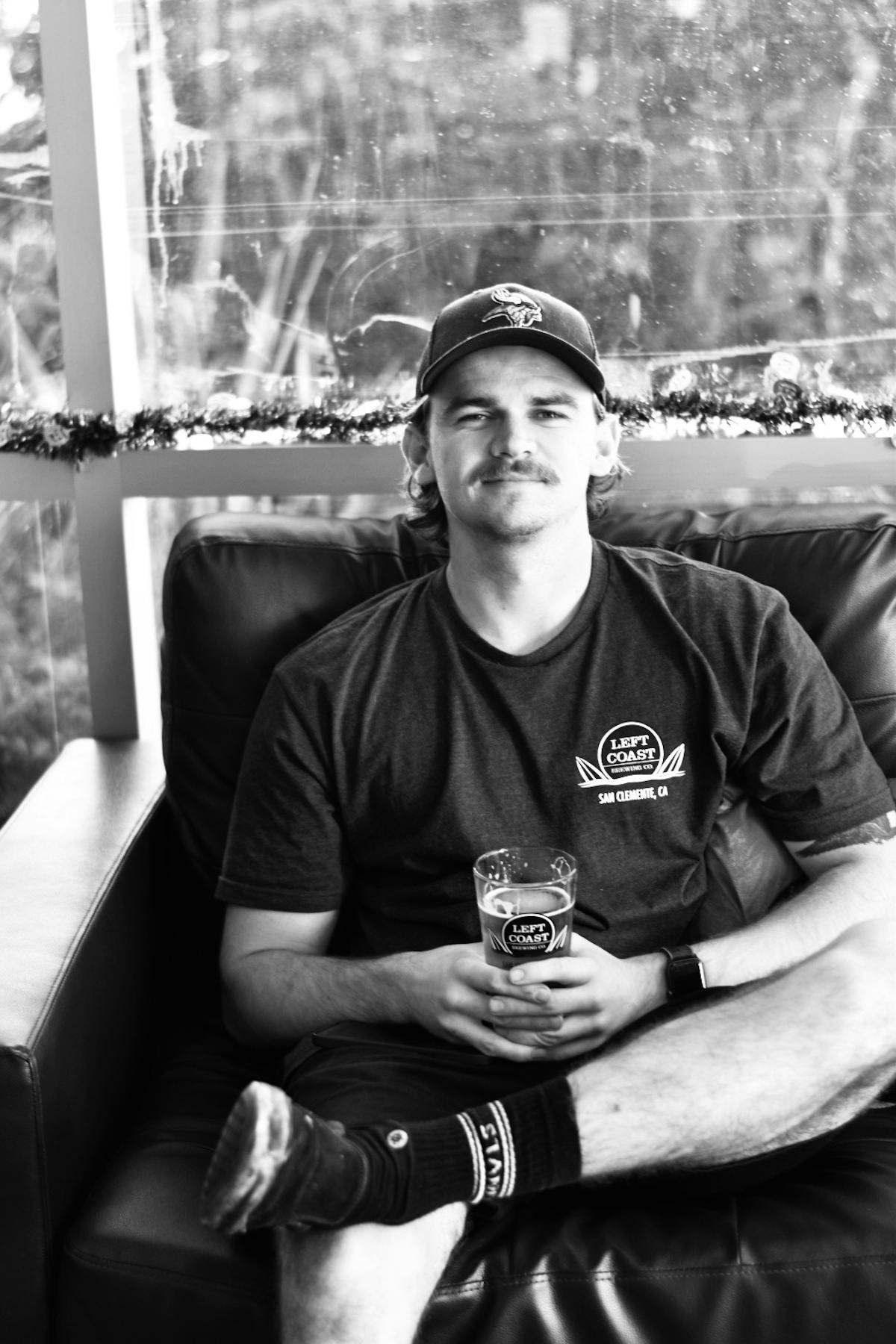 a man holding a glass of beer