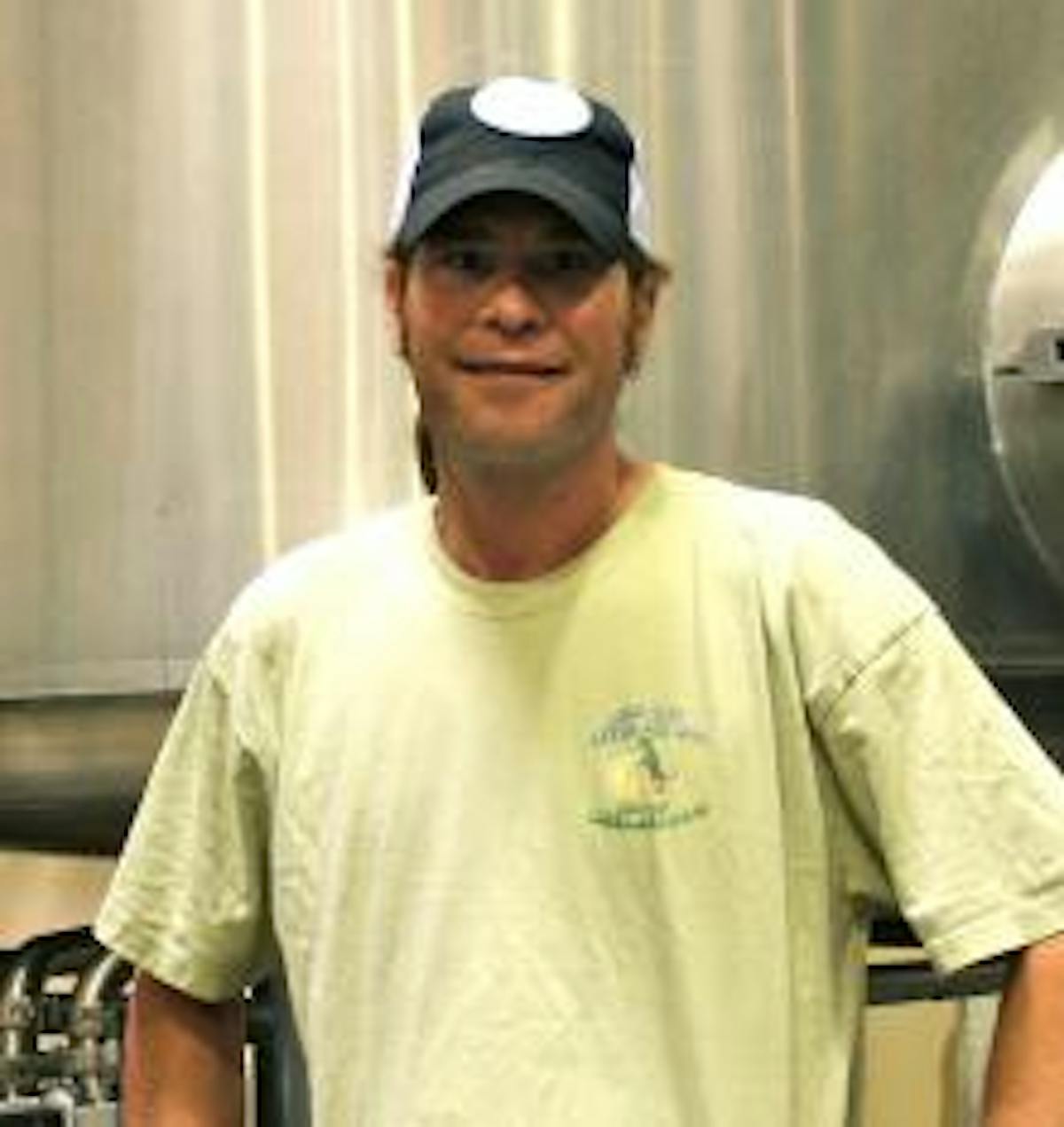 a man standing in a kitchen