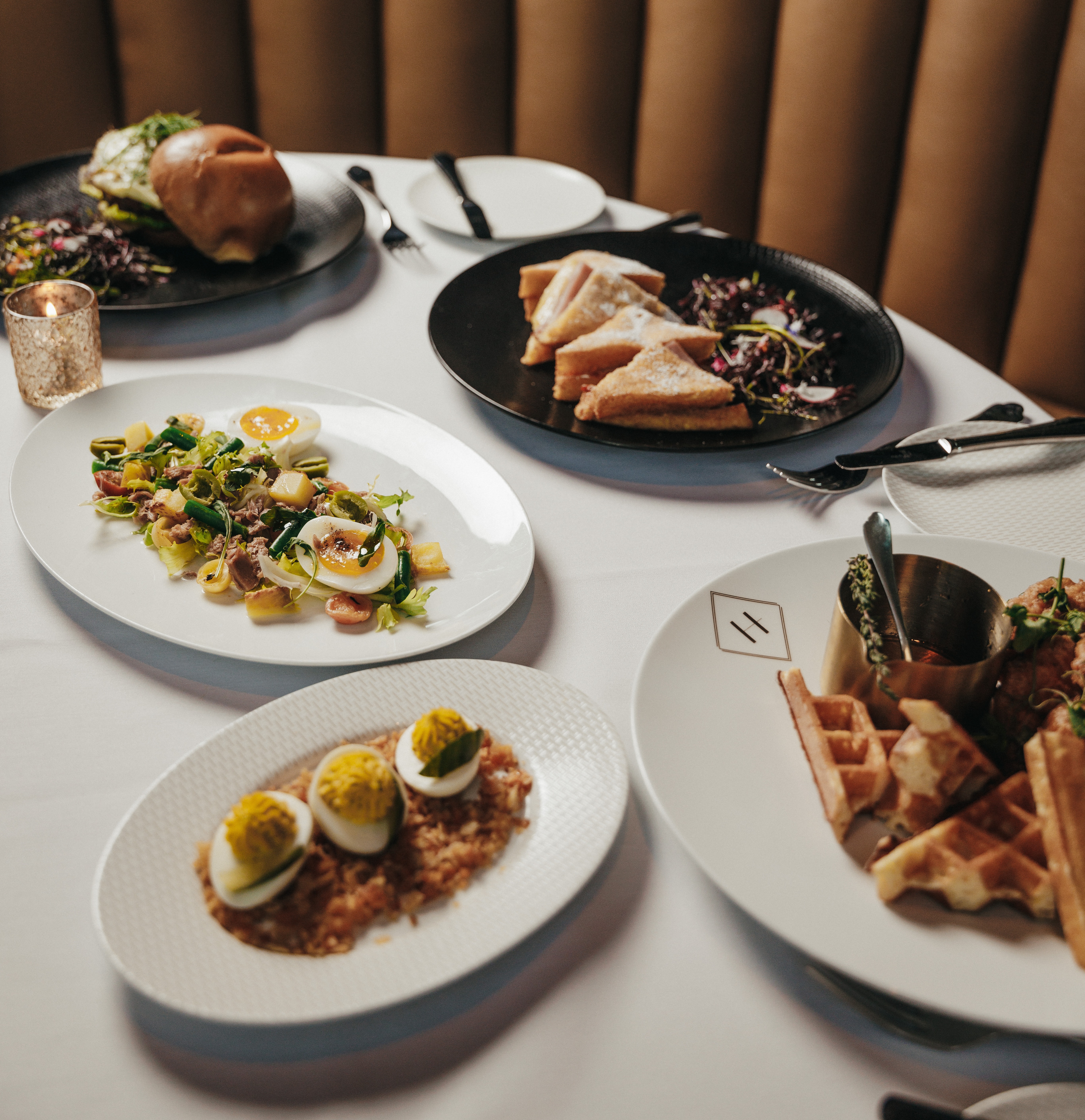 a table topped with plates of food on a plate