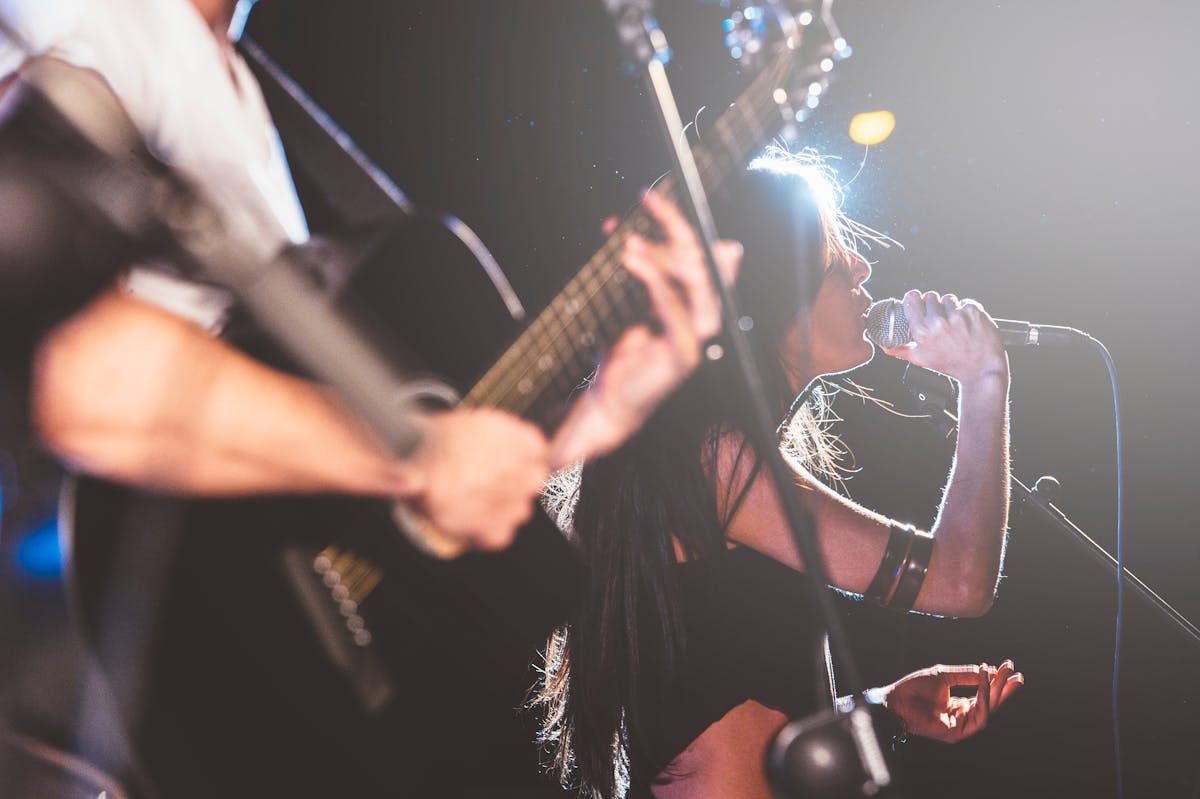 a person holding a guitar