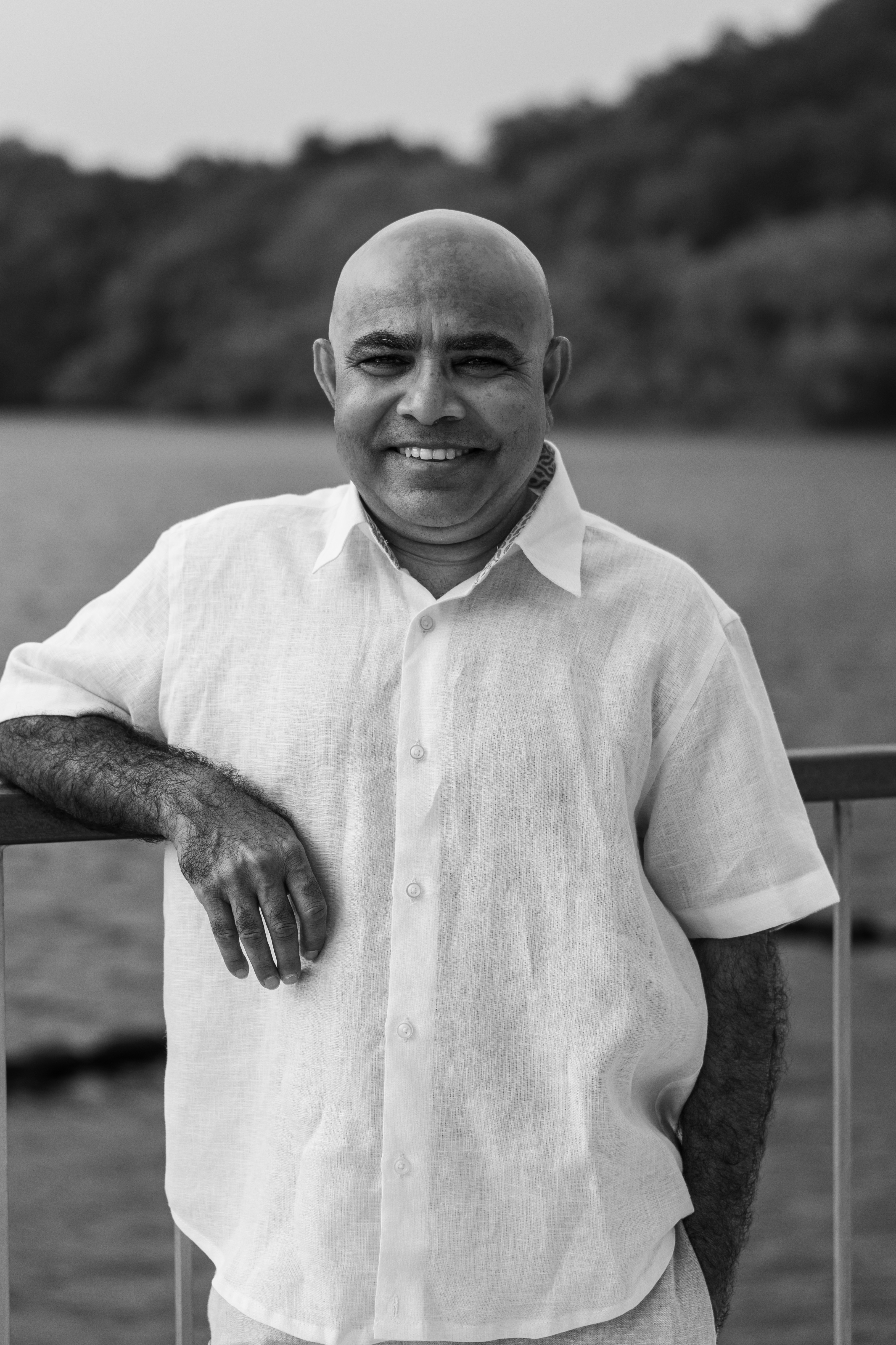 a man leaning on a railing