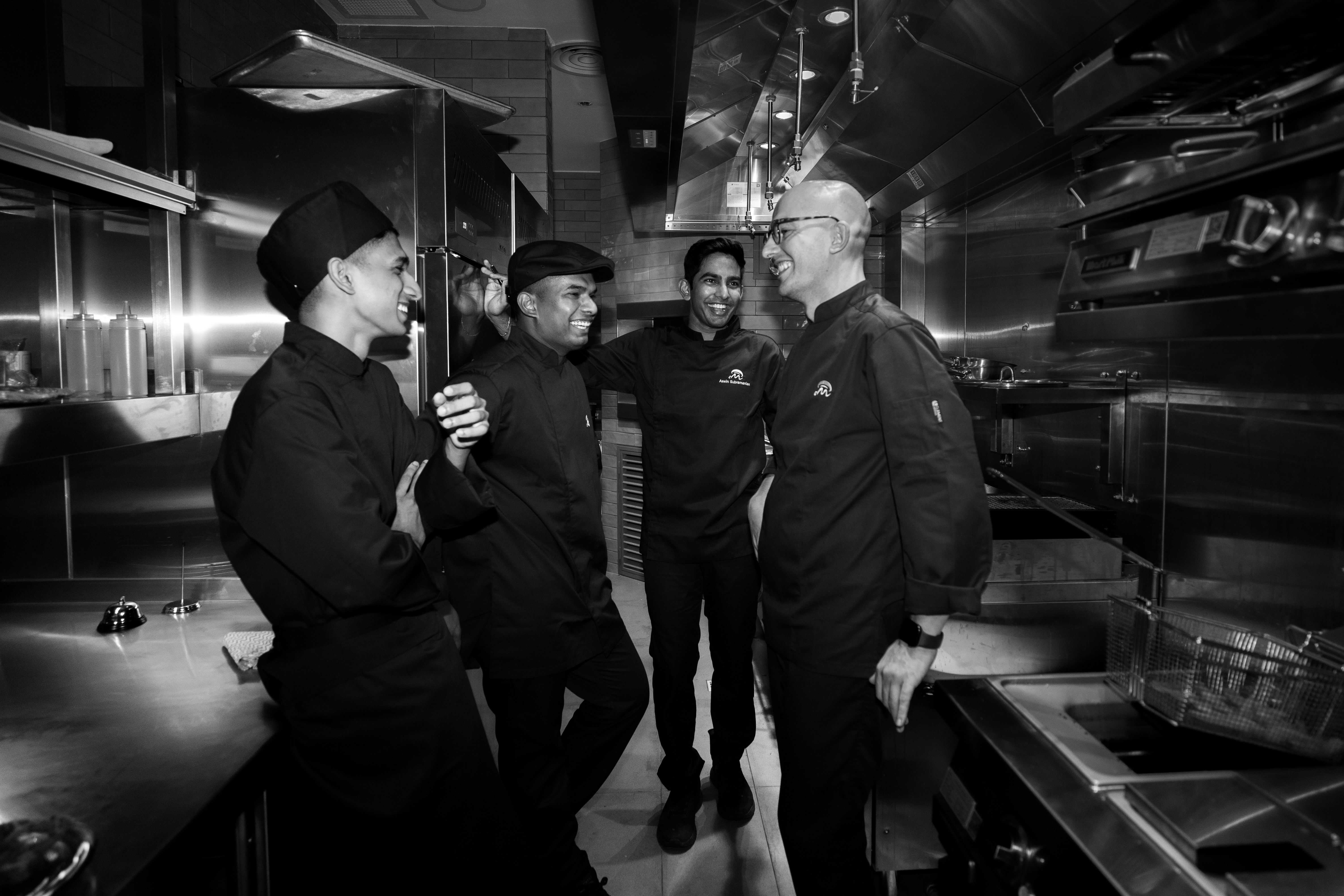 a group of chefs in a kitchen