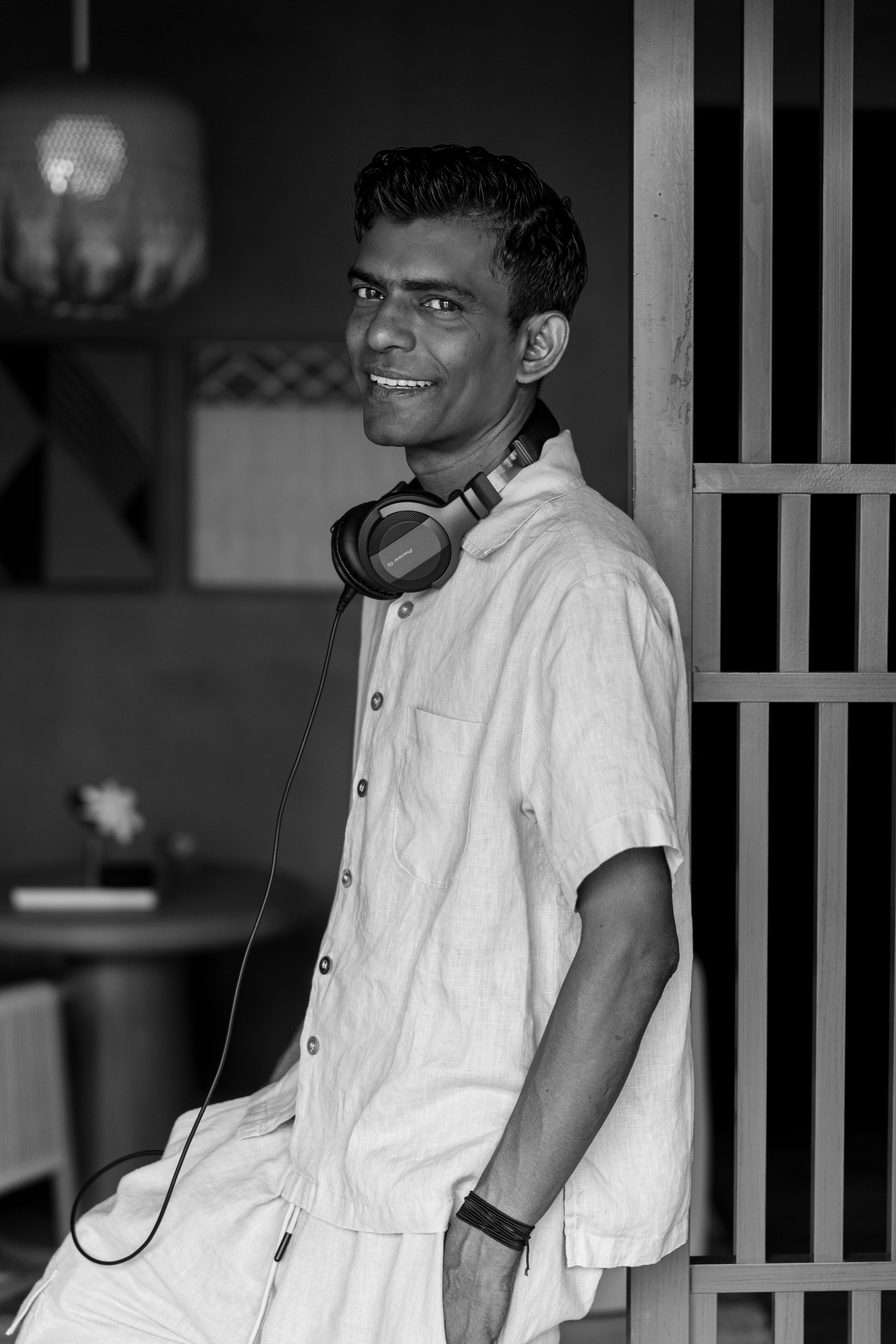 a man wearing headphones around his neck