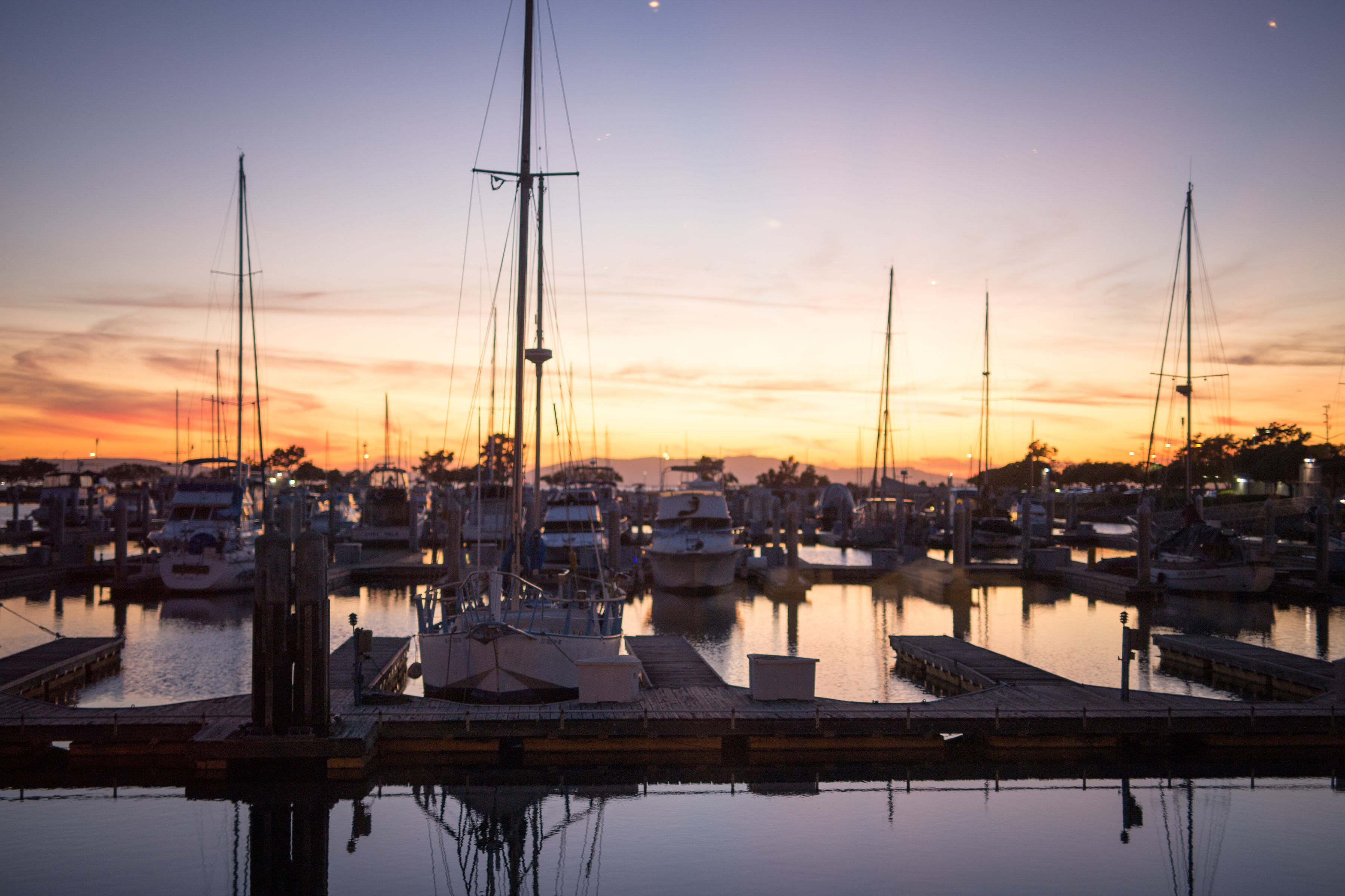 a boat is docked next to a body of water