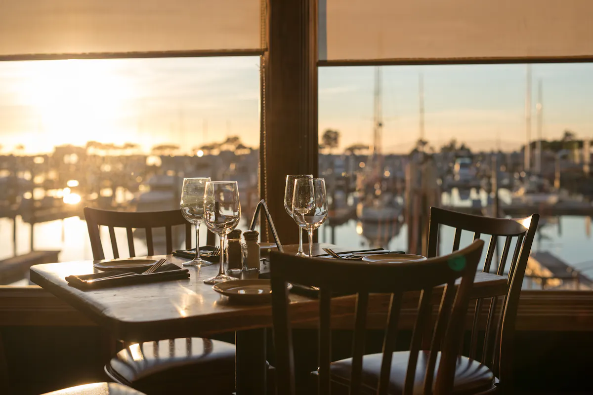a dining room table in front of a window