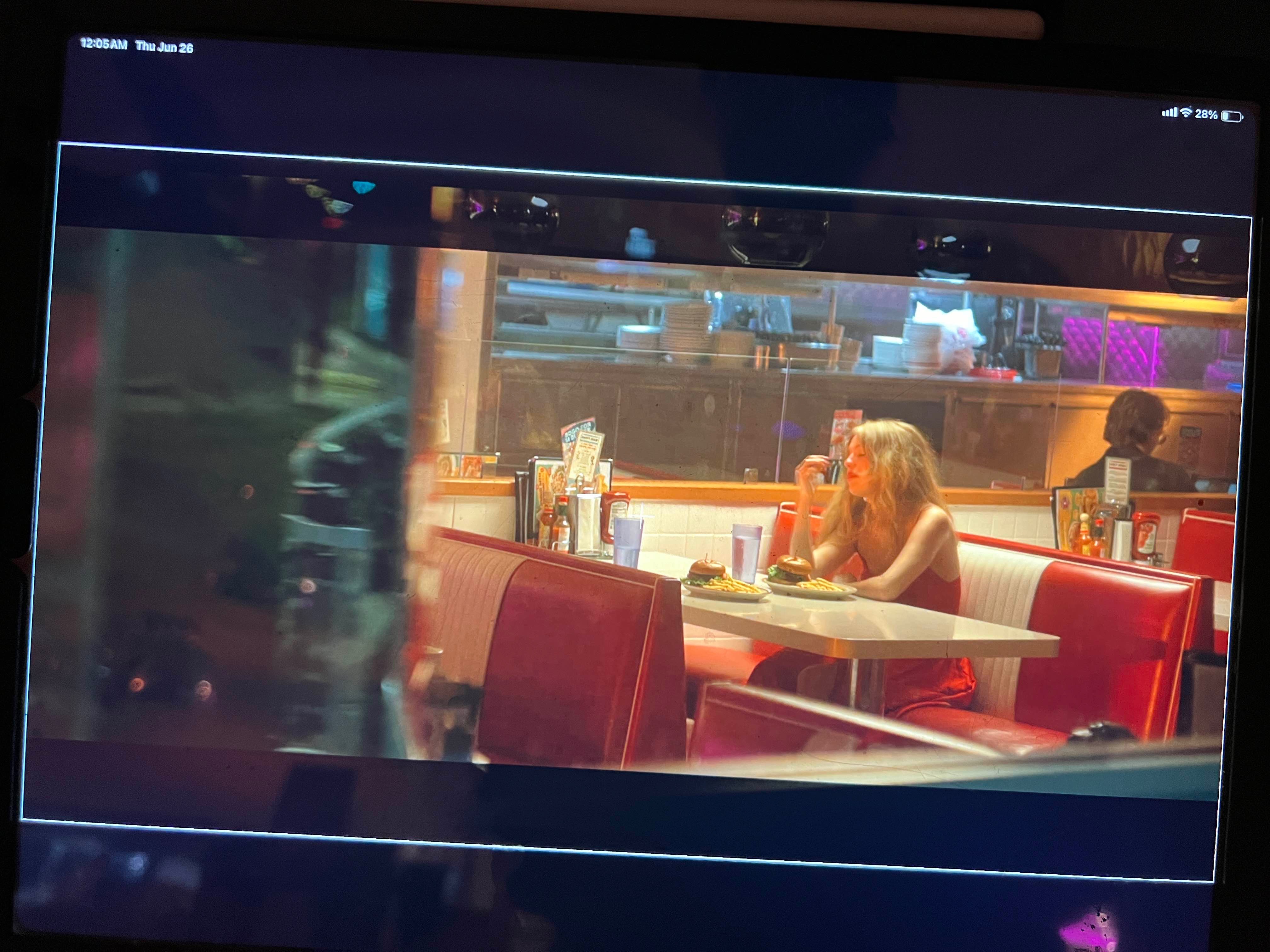 Girl eating at diner