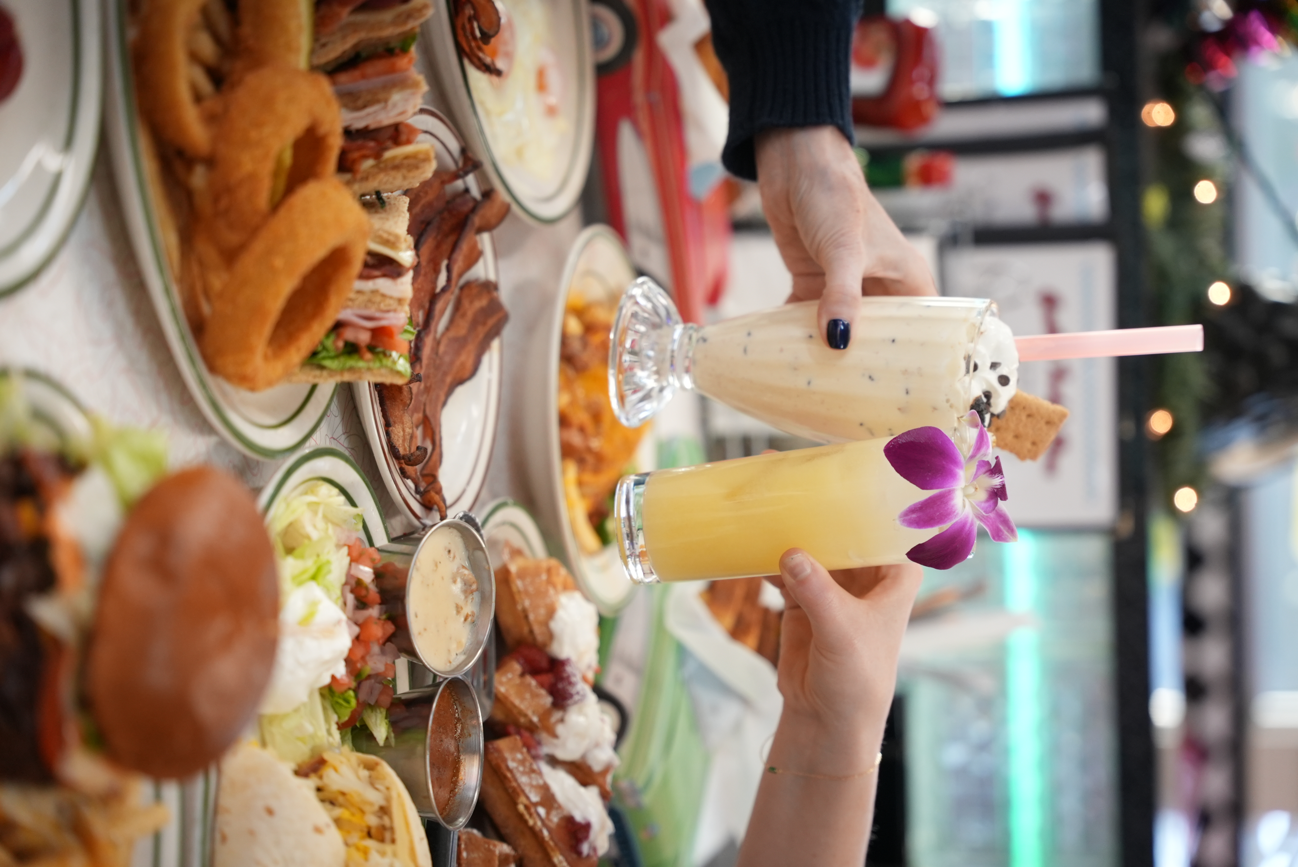 a person sitting at a table with a plate of food