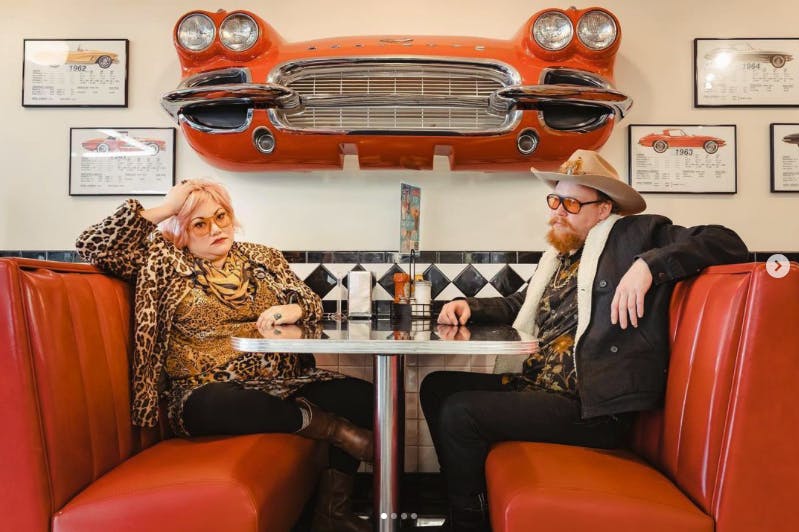 a group of people sitting in a chair