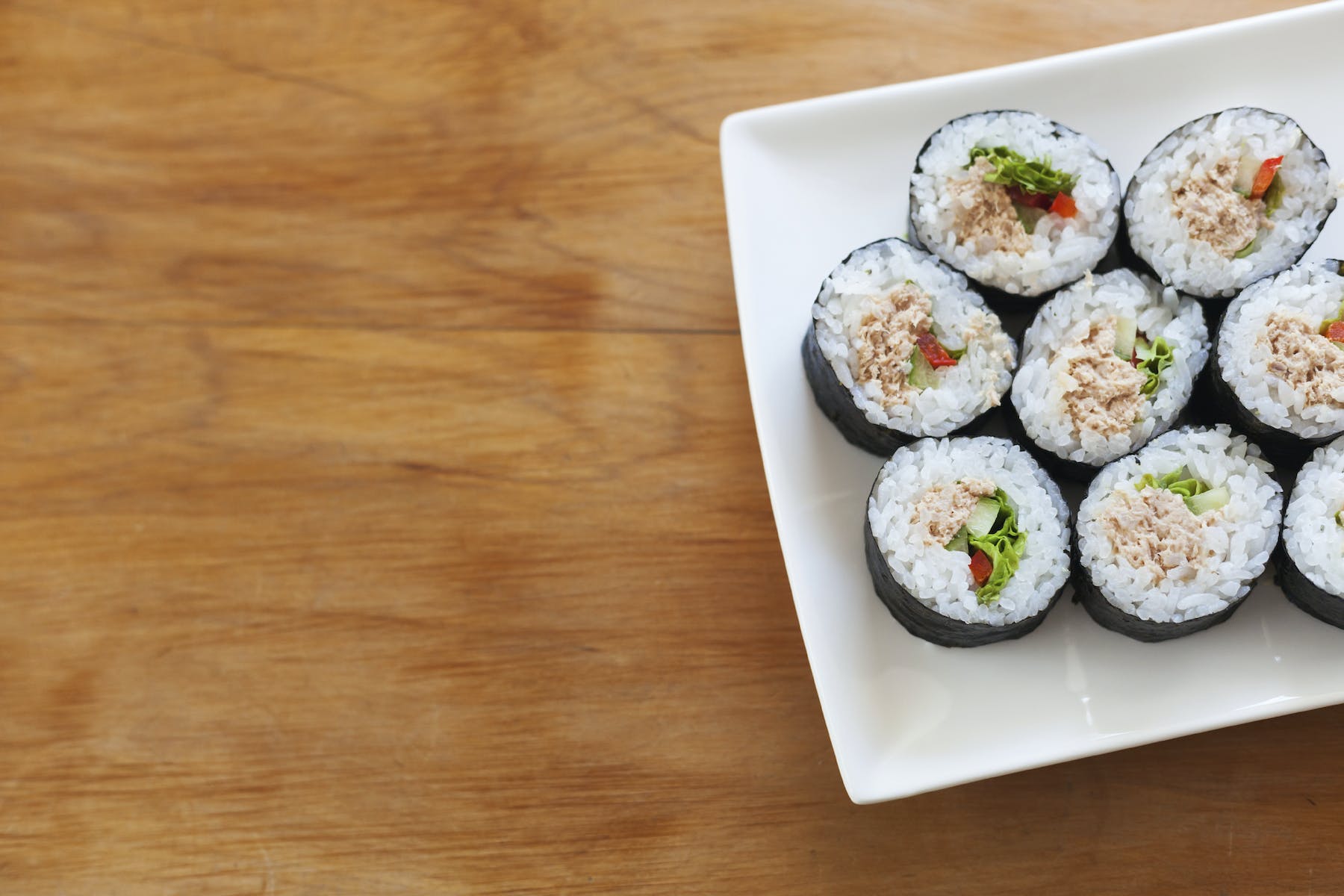 sushi on a plate on a cutting board