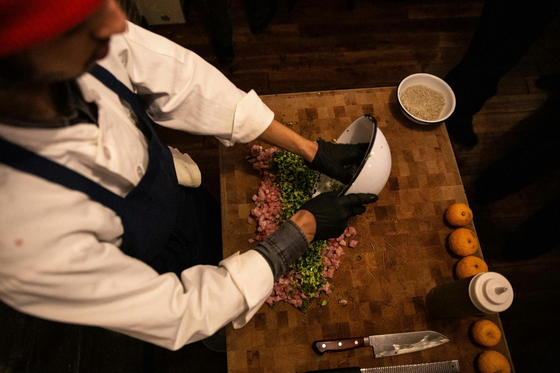 a man with a knife on a cutting board